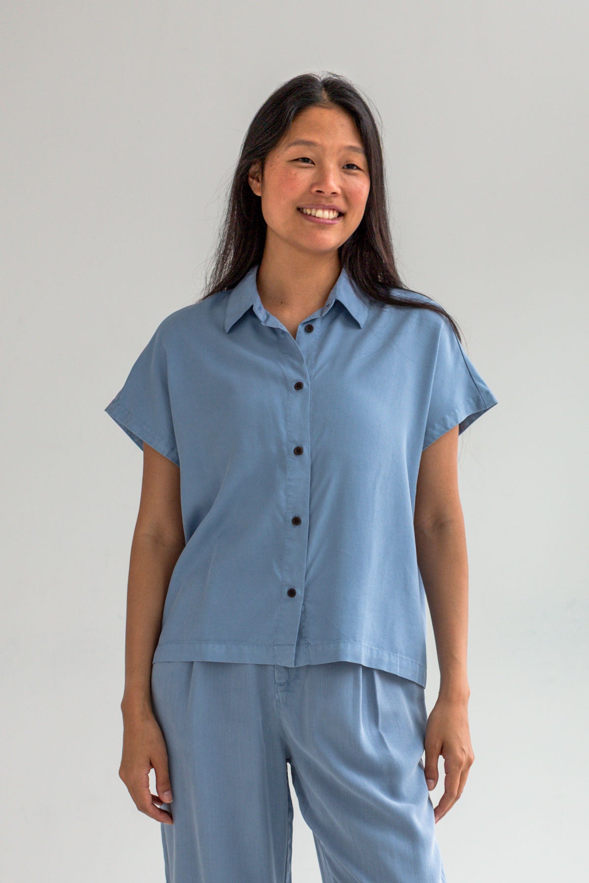 Denim blue lightweight shirt women light blue pants wear view front