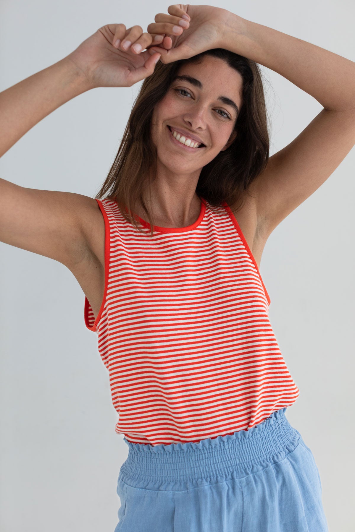 Bright red stripes lightweight vest top women light blue shorts wear view front