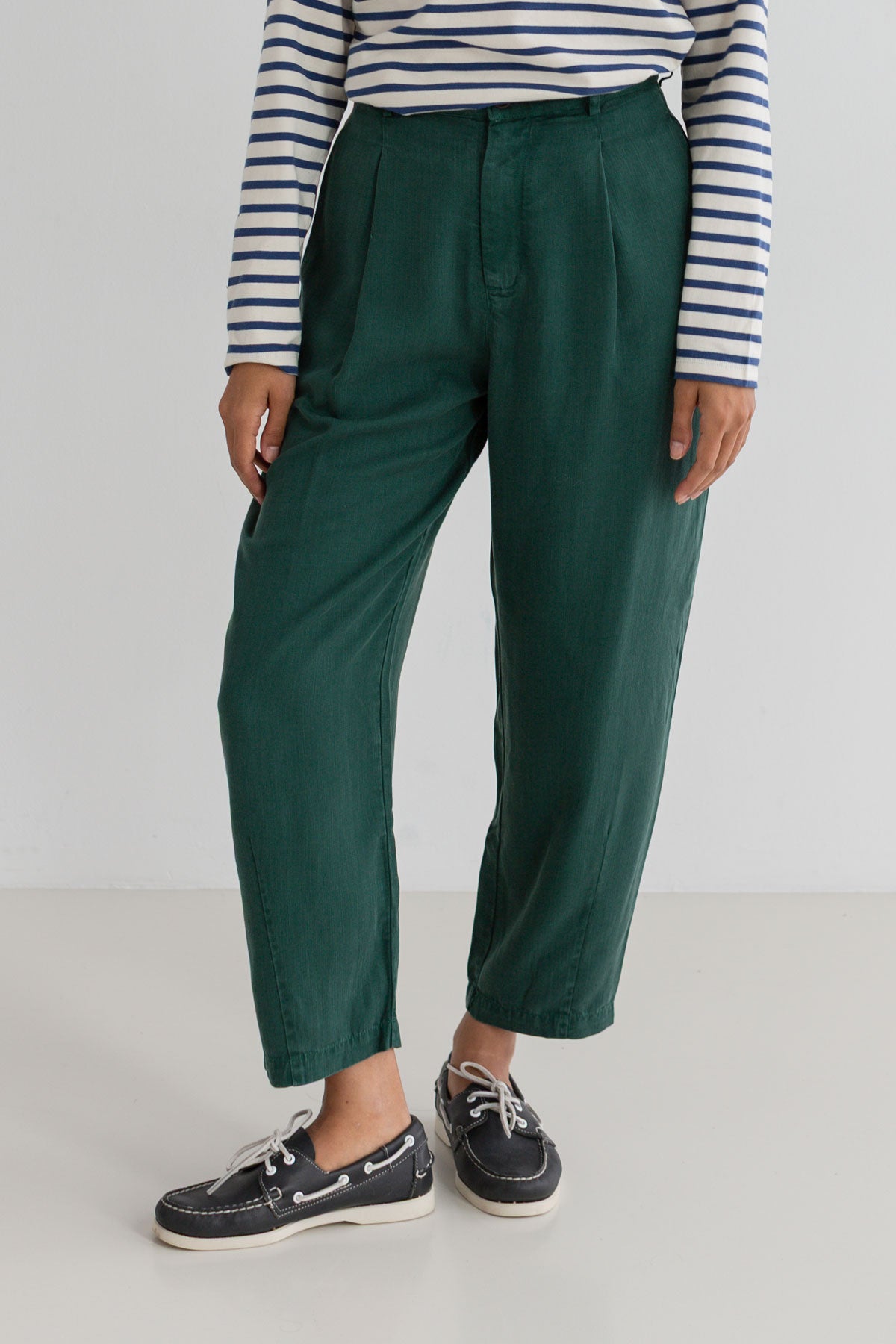 Dark green lyocell pants women striped tshirt full body view front