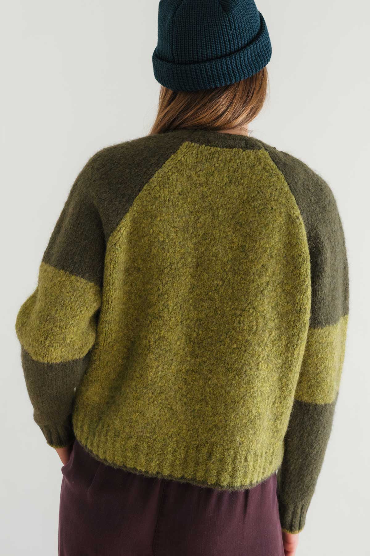 Responsible yarn sweater in earthy greens