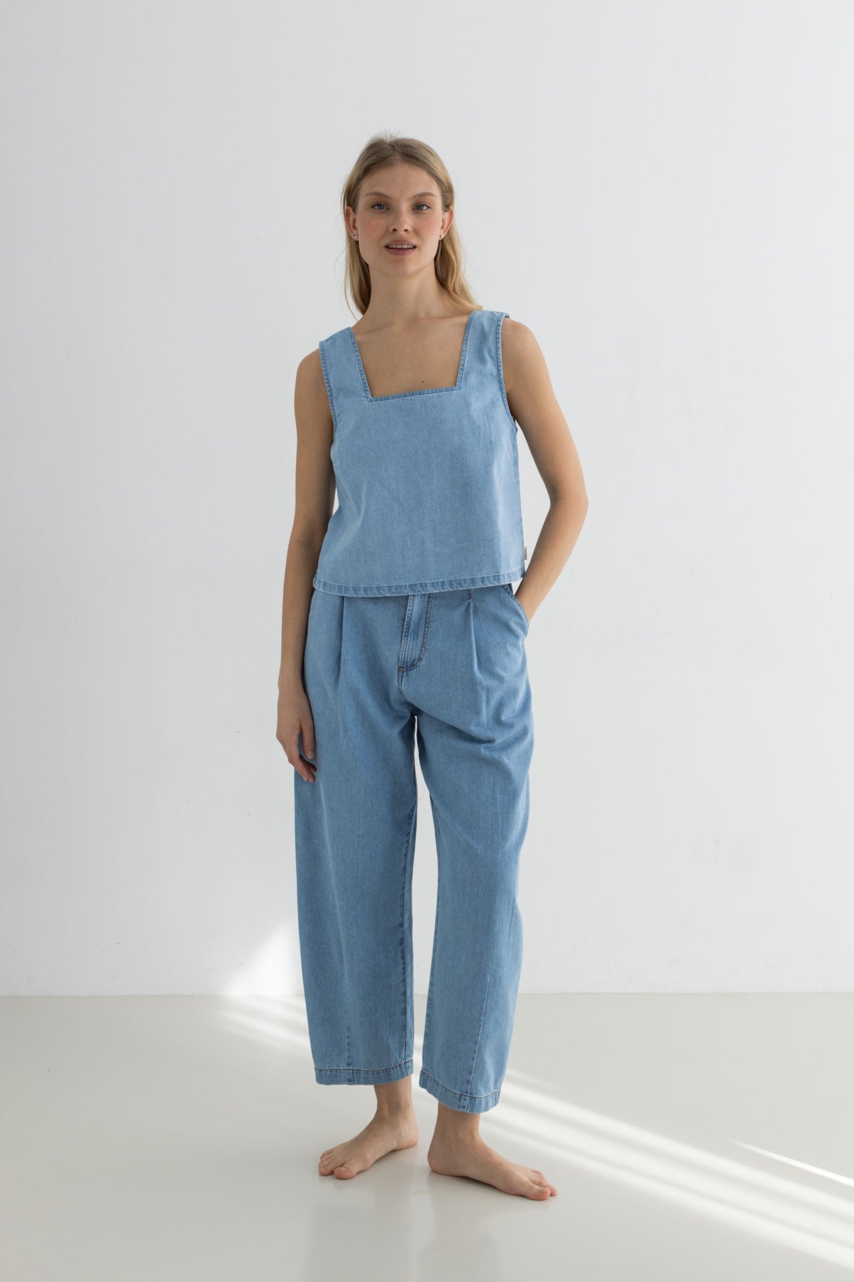 Light blue denim shirt women denim trousers full body view front