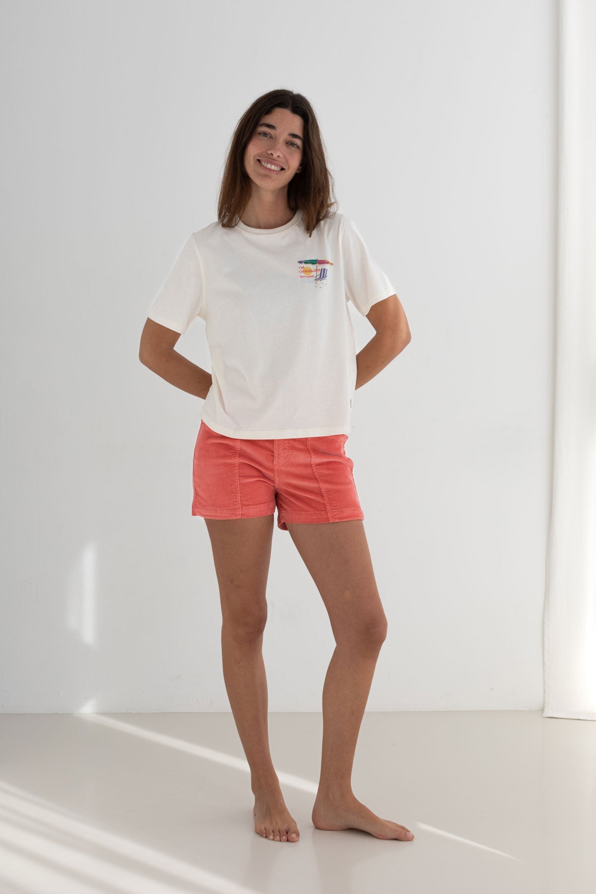 Off white cotton top women coral shorts full body view front