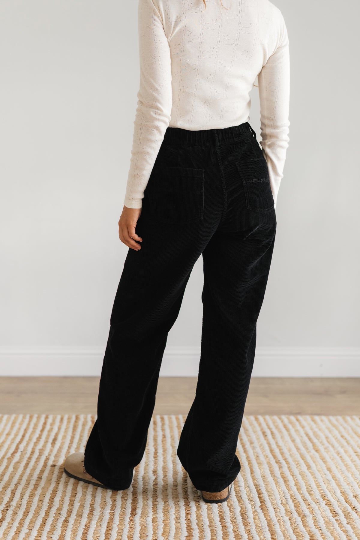 Back view black corduroy pants