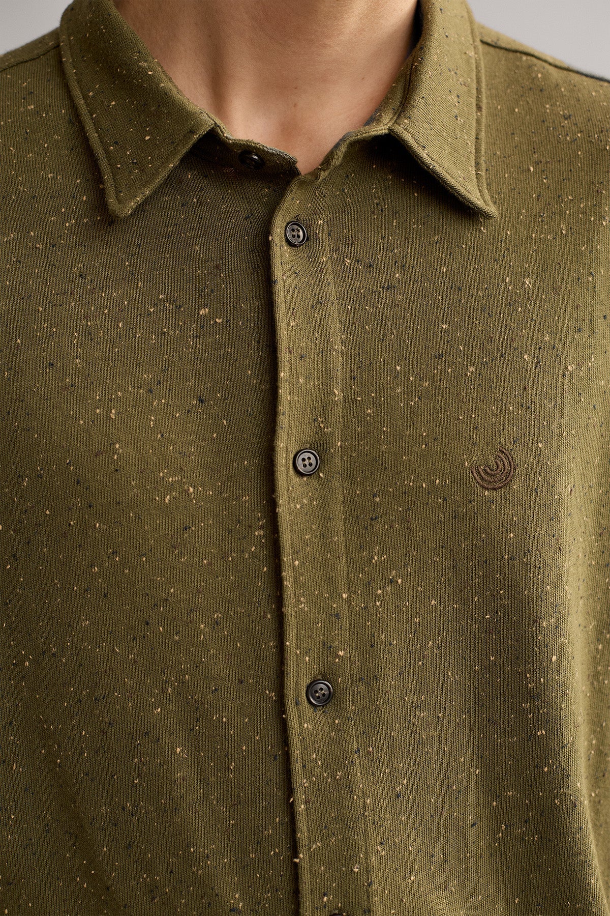 sustainable green jersey shirt with embroidered logo