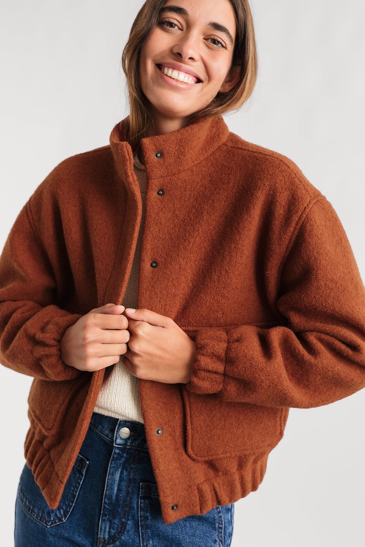 meta-preview, boiled wool jacket in burnt orange with cropped cut