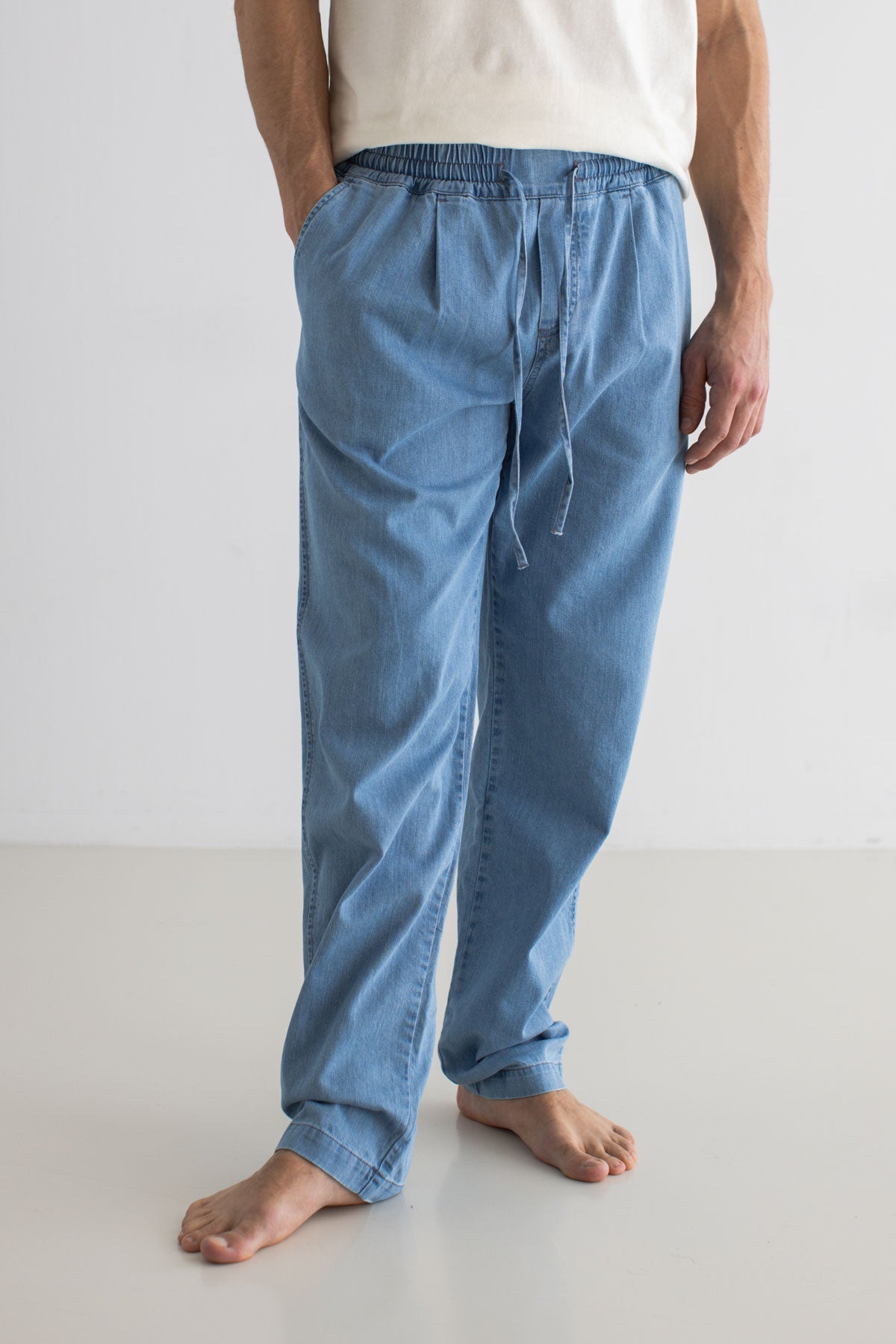Light blue denim trousers men wear view front