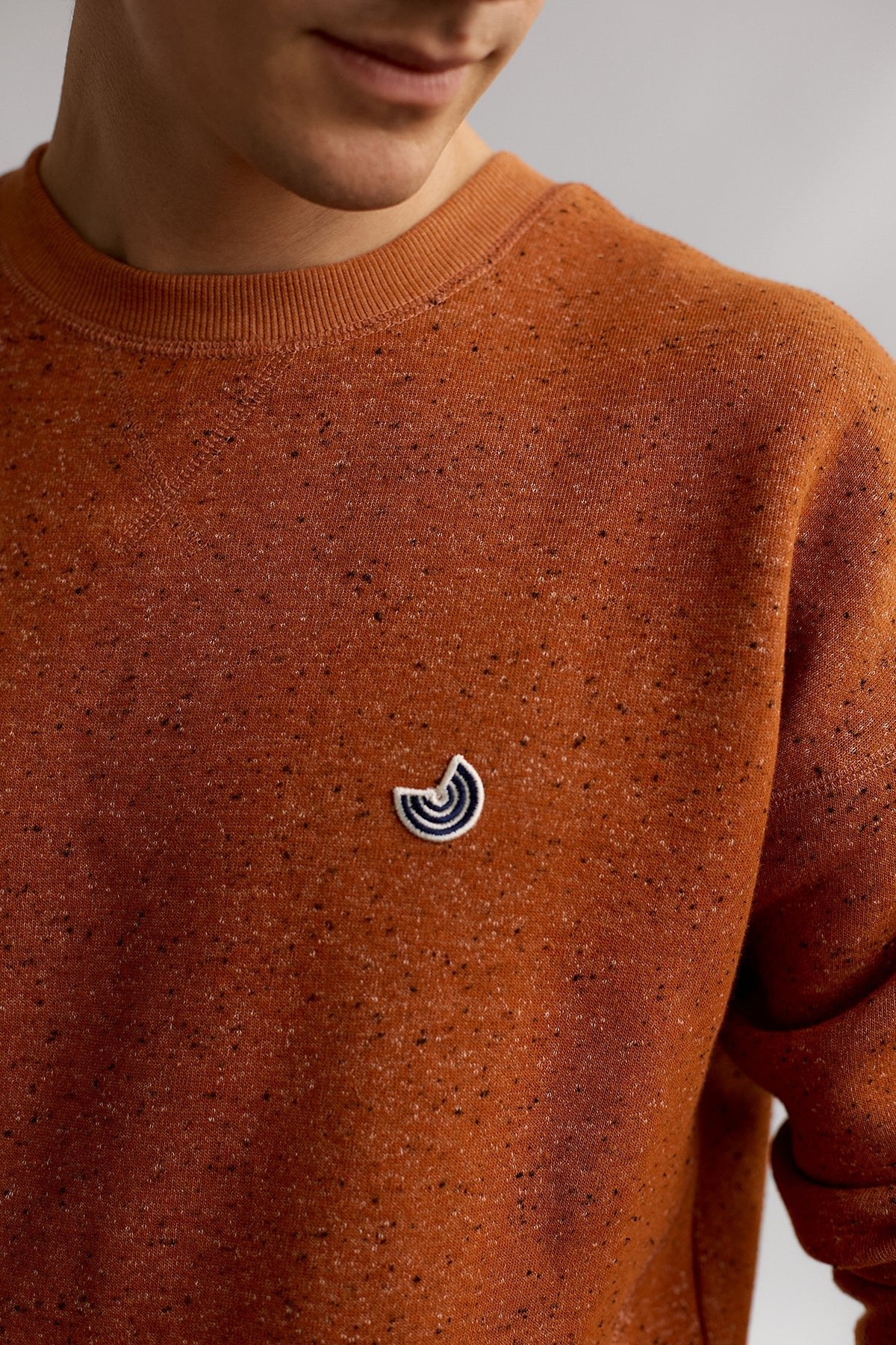 meta-hover, regular fit orange sweater with embroidered logo