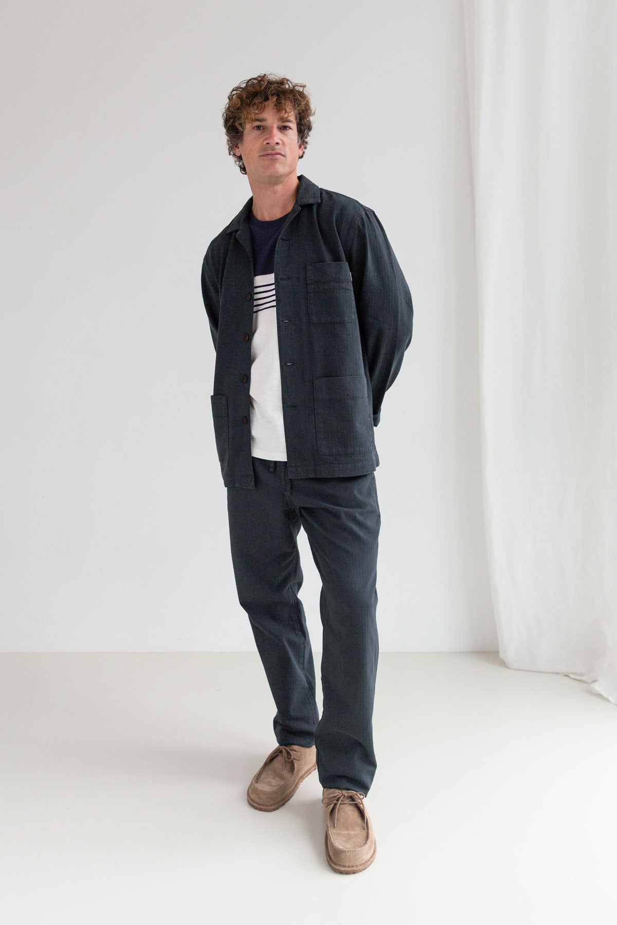 Dark navy organic cotton jacket men navy pants full body view front