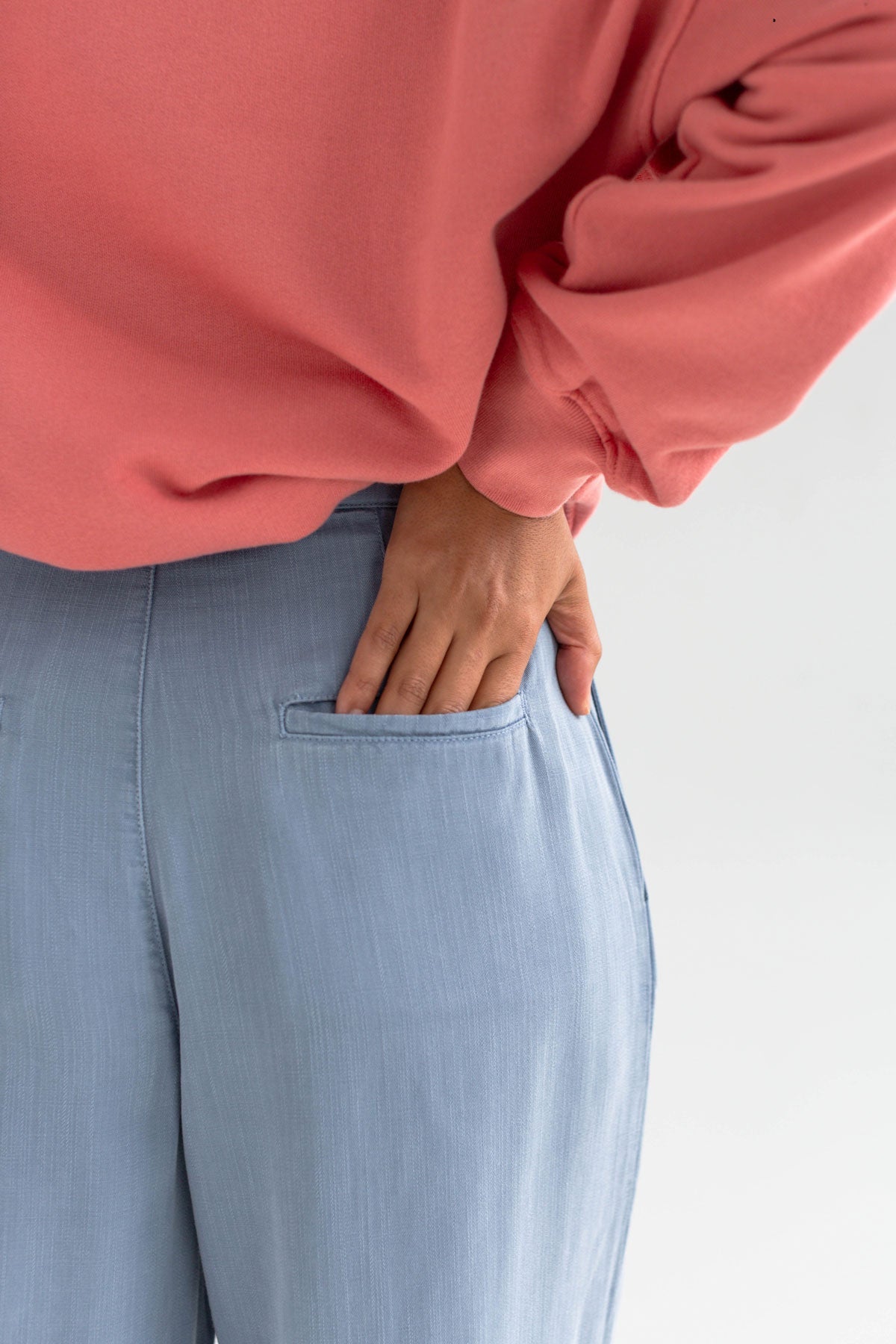Denim blue lyocell pants women pink sweatshirt detail back