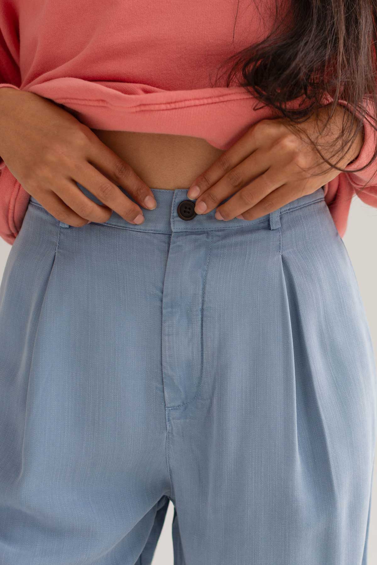 Denim blue lyocell pants women pink sweatshirt detail front