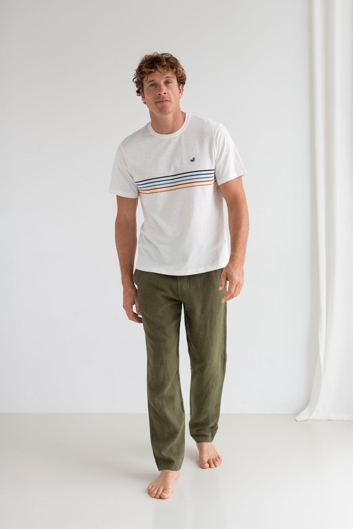 Off white round neck tshirt men green pants full body view front