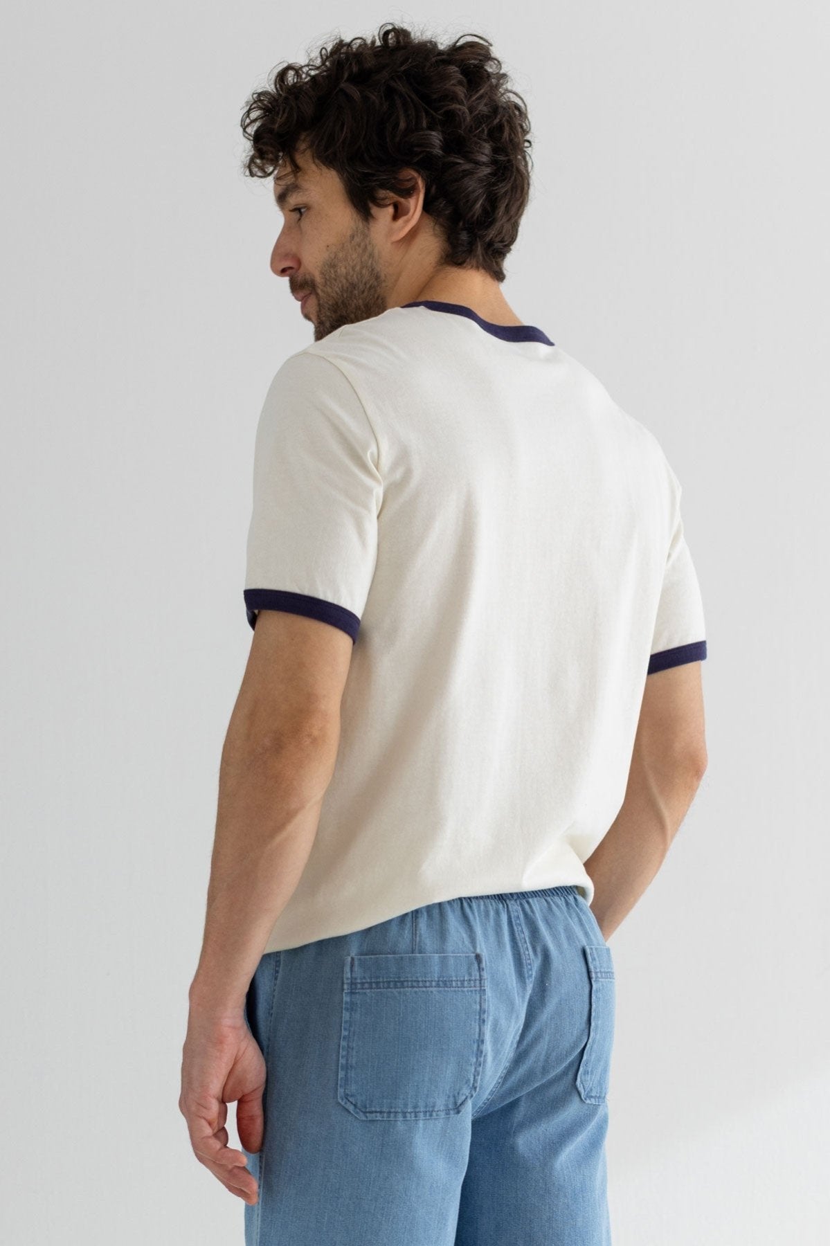 White blue tshirt men denim shorts wear view back
