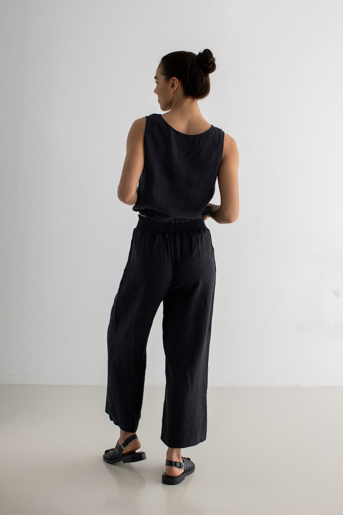 Black Sleeveless linen shirt women black pants full body view back