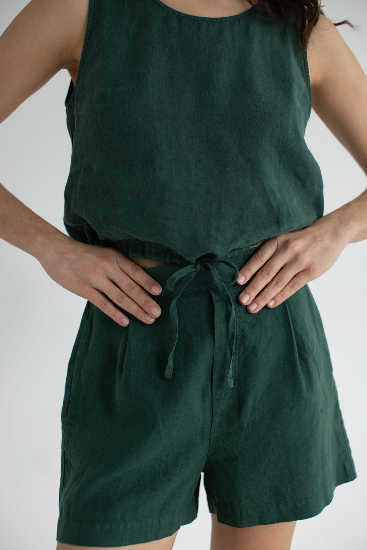 Garden green sleeveless linen shirt women green pants wear view front