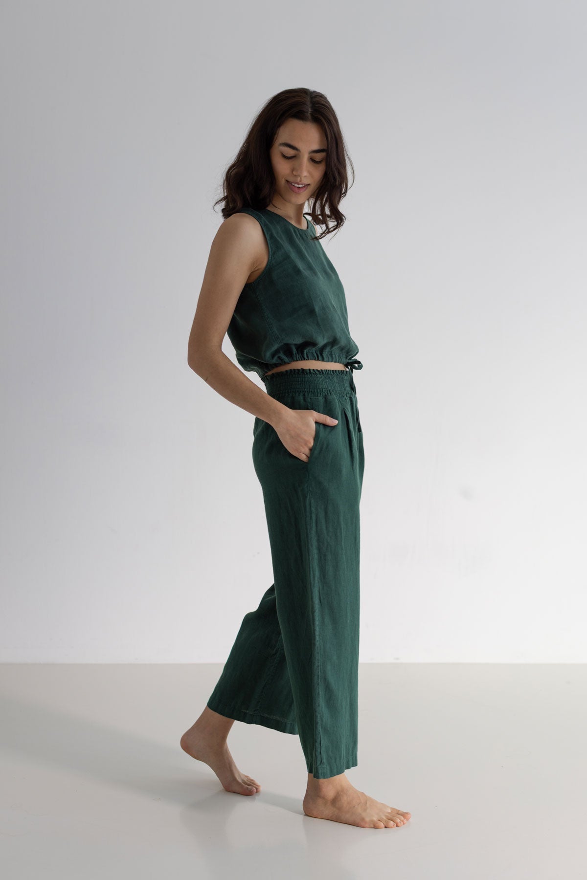 Garden green sleeveless linen shirt women green pants full body view side