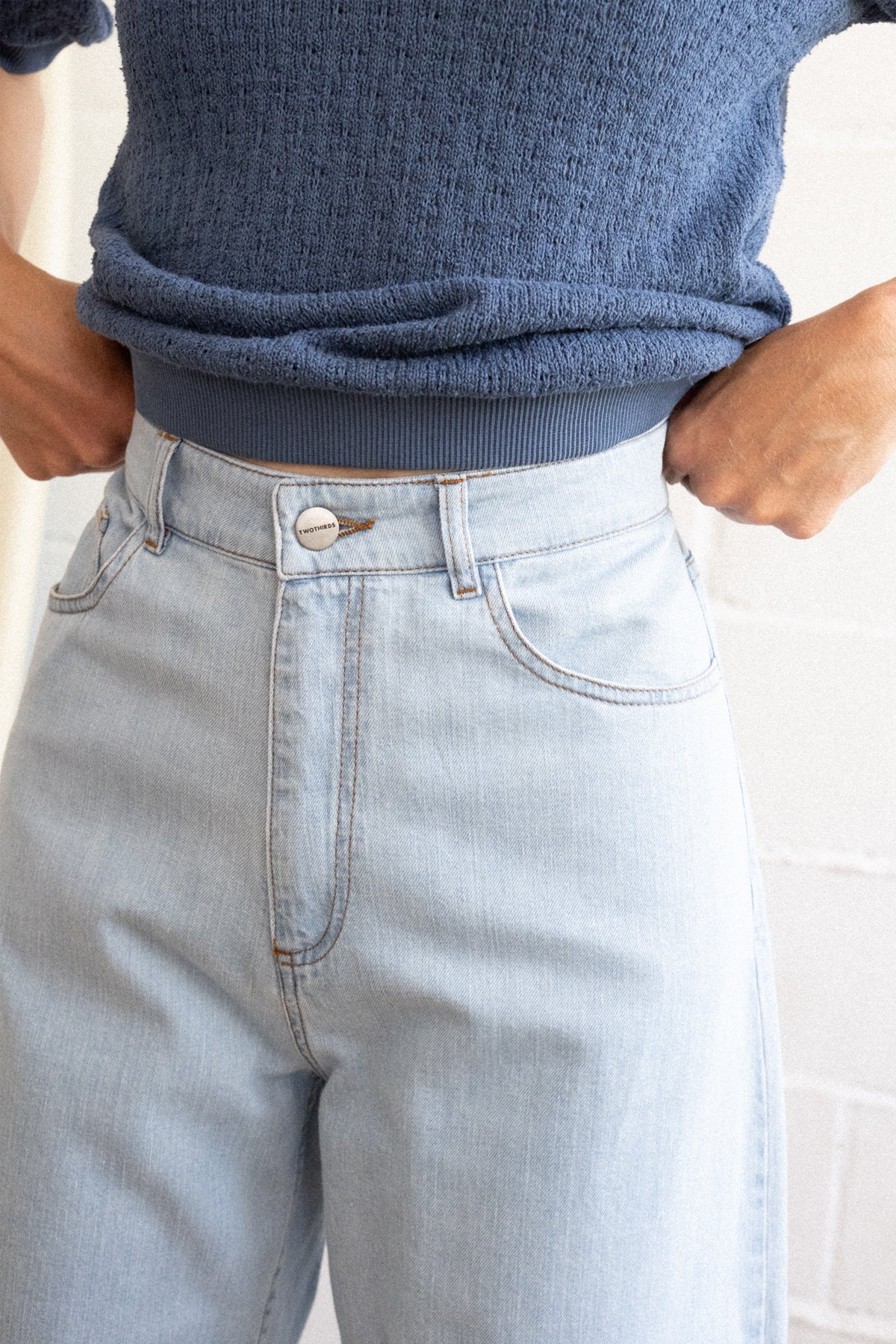 blue denim pants with a tapered waist