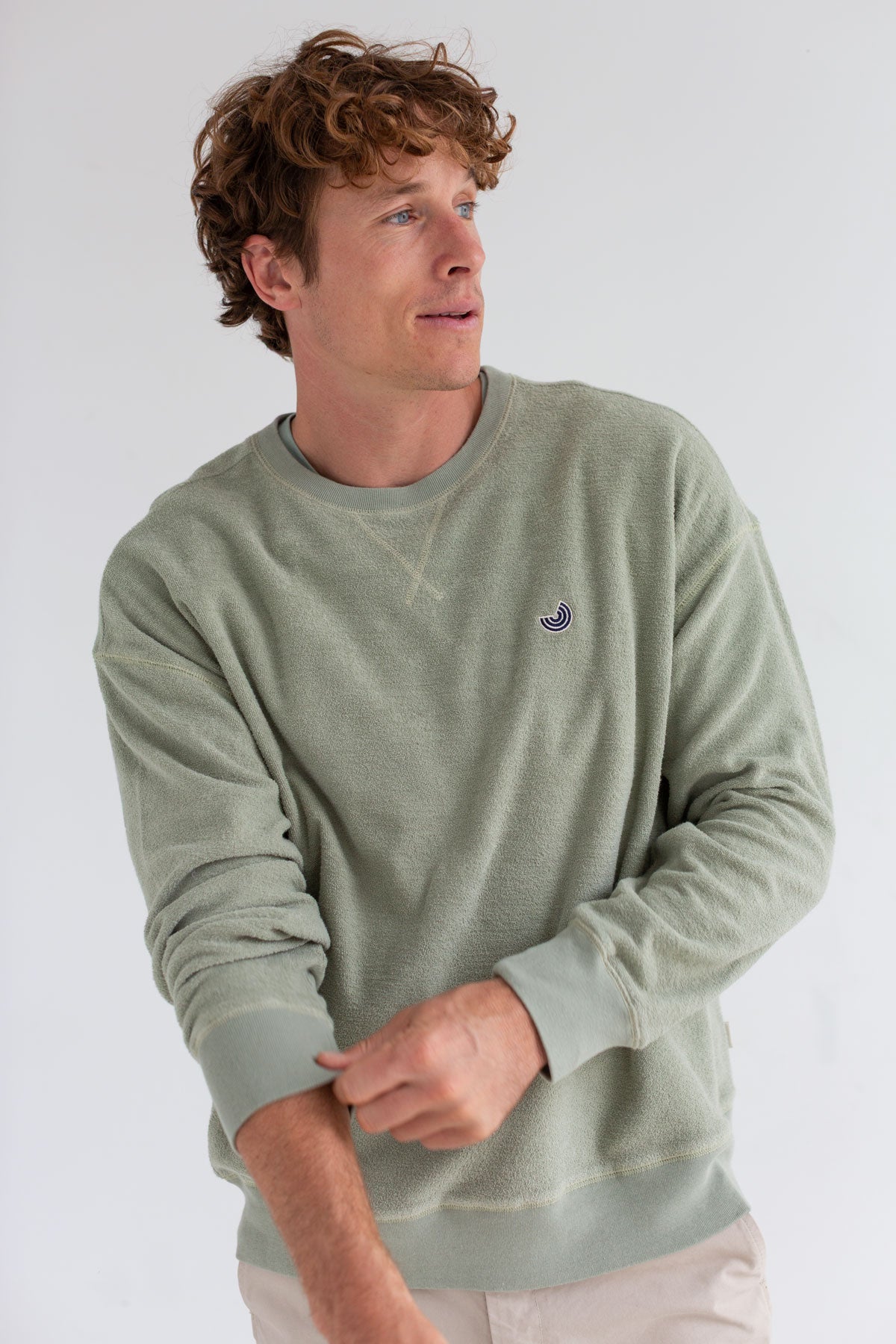 Light green sweatshirt men light pants wear view front