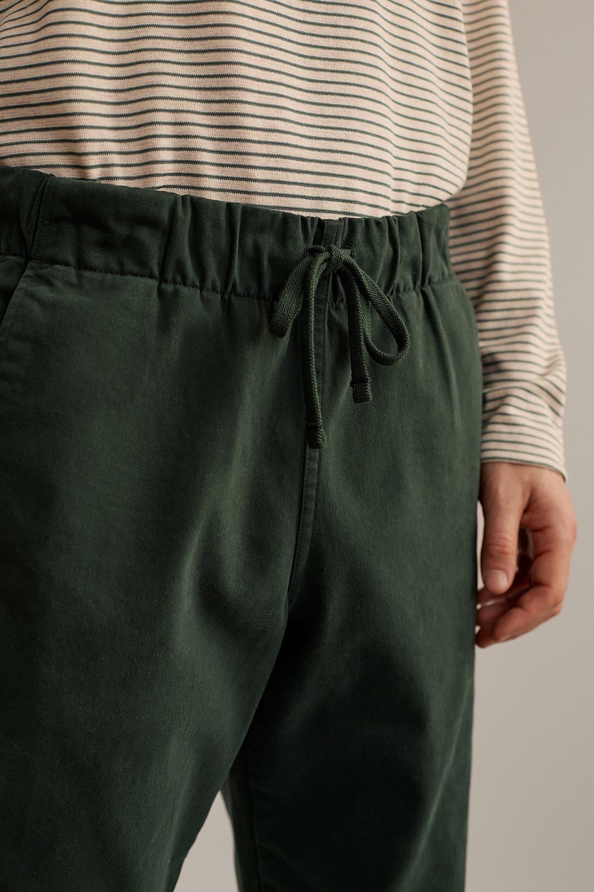 green pants with elasticated waistband and drawstring