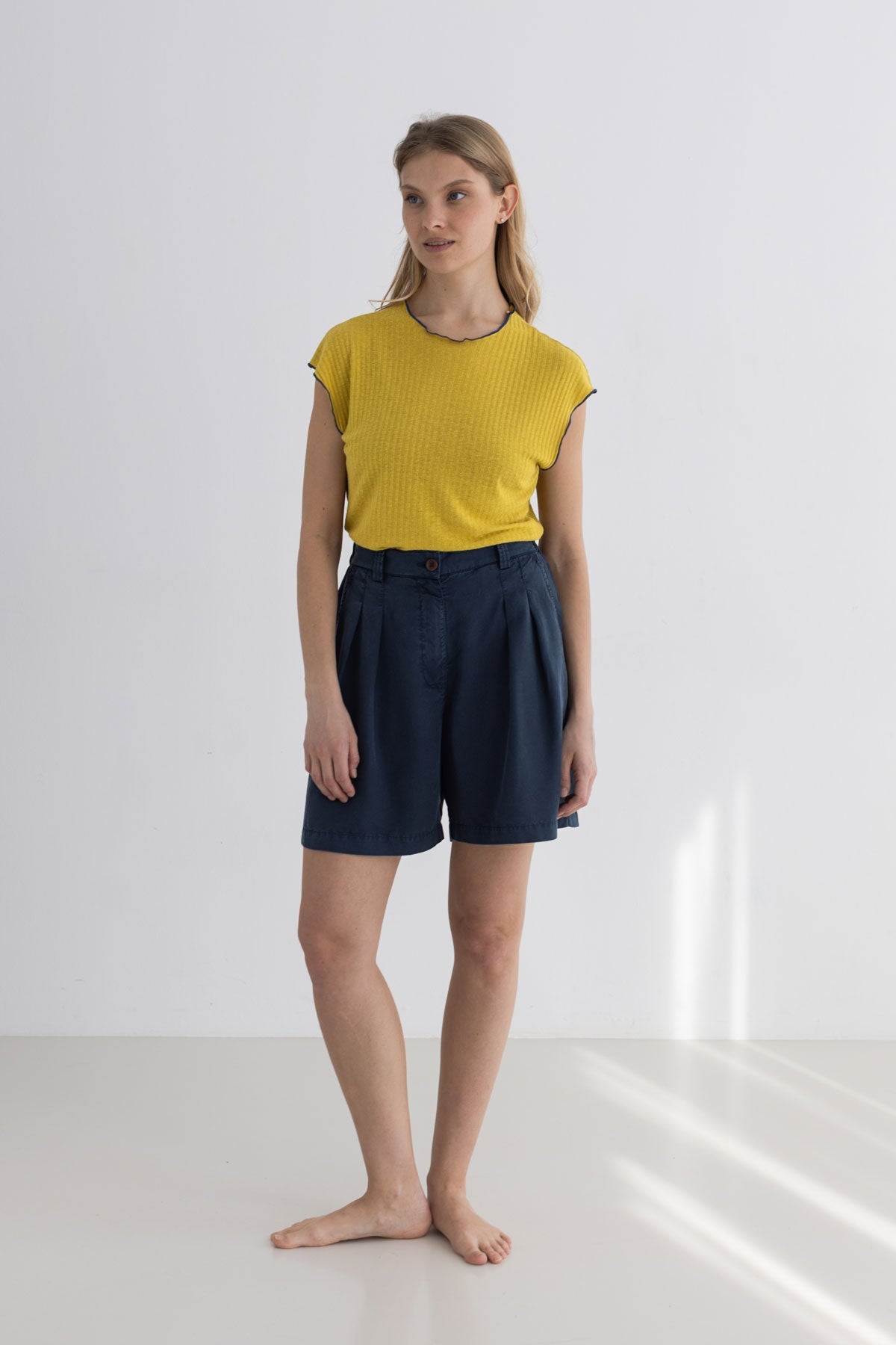Golden green ribbed tshirt women navy shorts full body view front