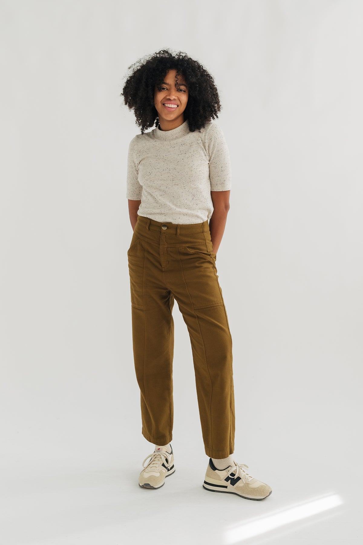 meta-hover, model in dusty ochre high-waisted flannel pants