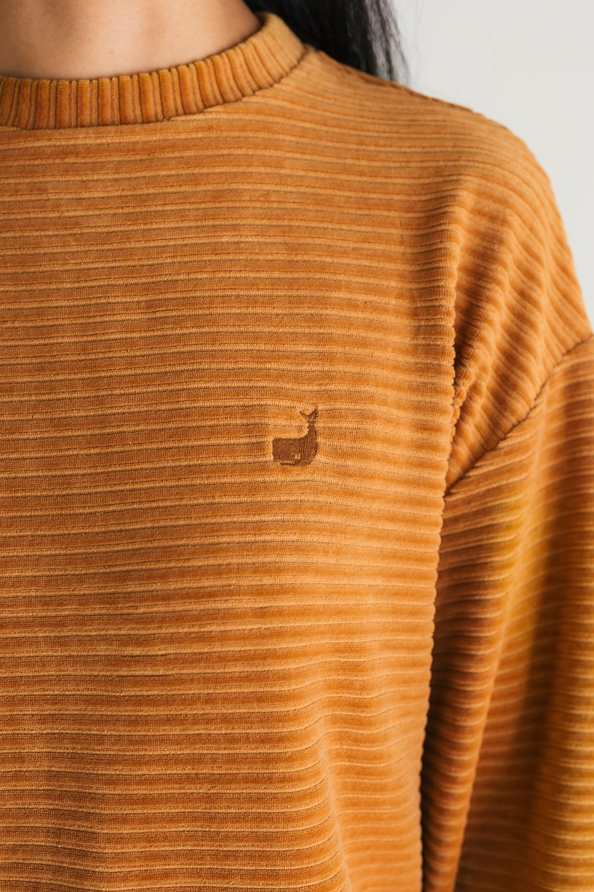 meta-hover, ribbed velour mustard sweatshirt with embroidered whale