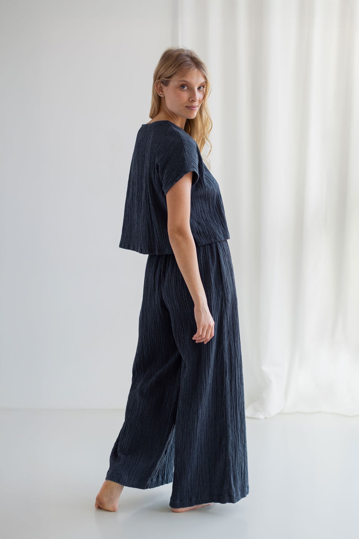 Dusty blue wide leg pants women dusty blue shirt full body view back