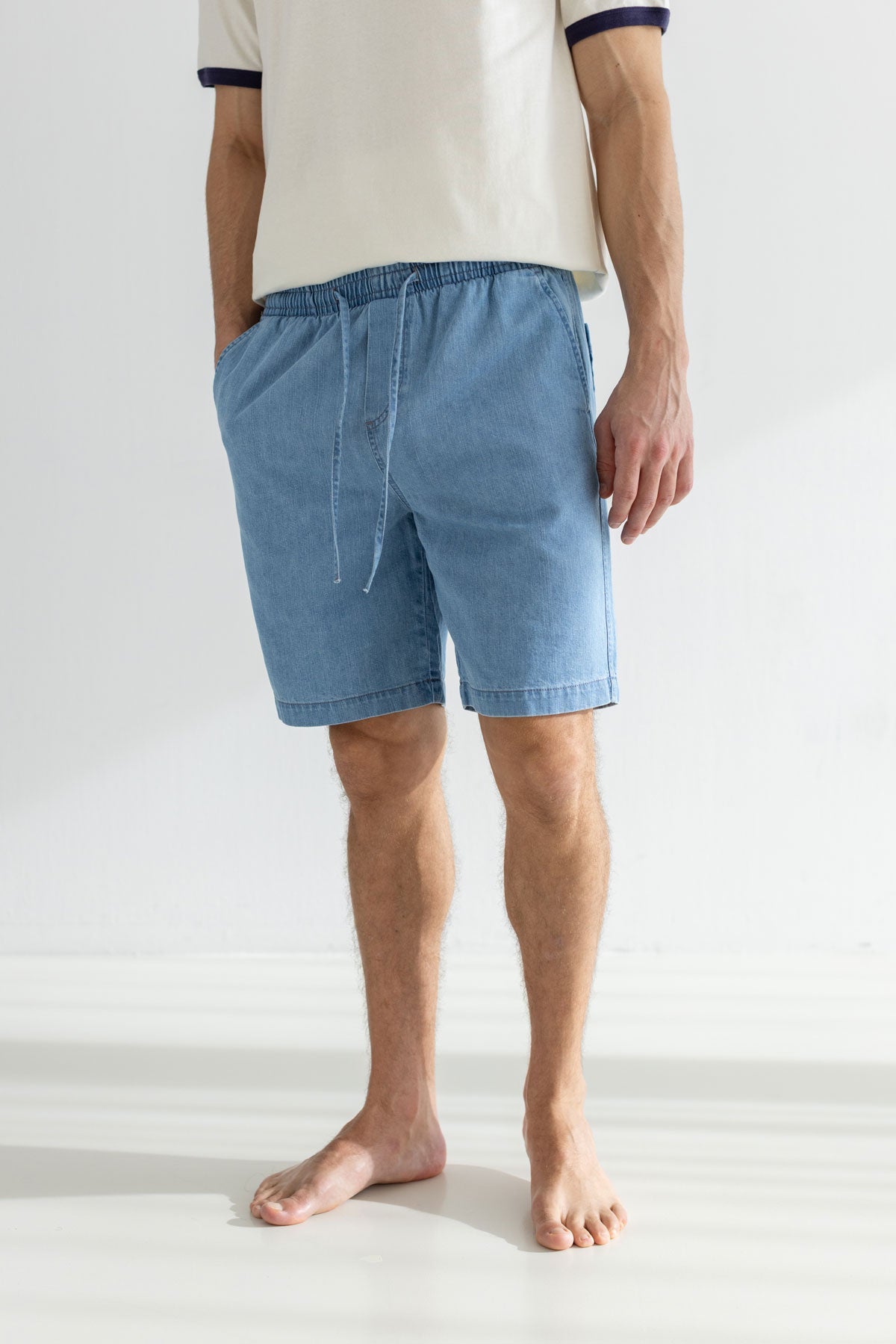 Light blue light denim shorts men light shirt wear view front