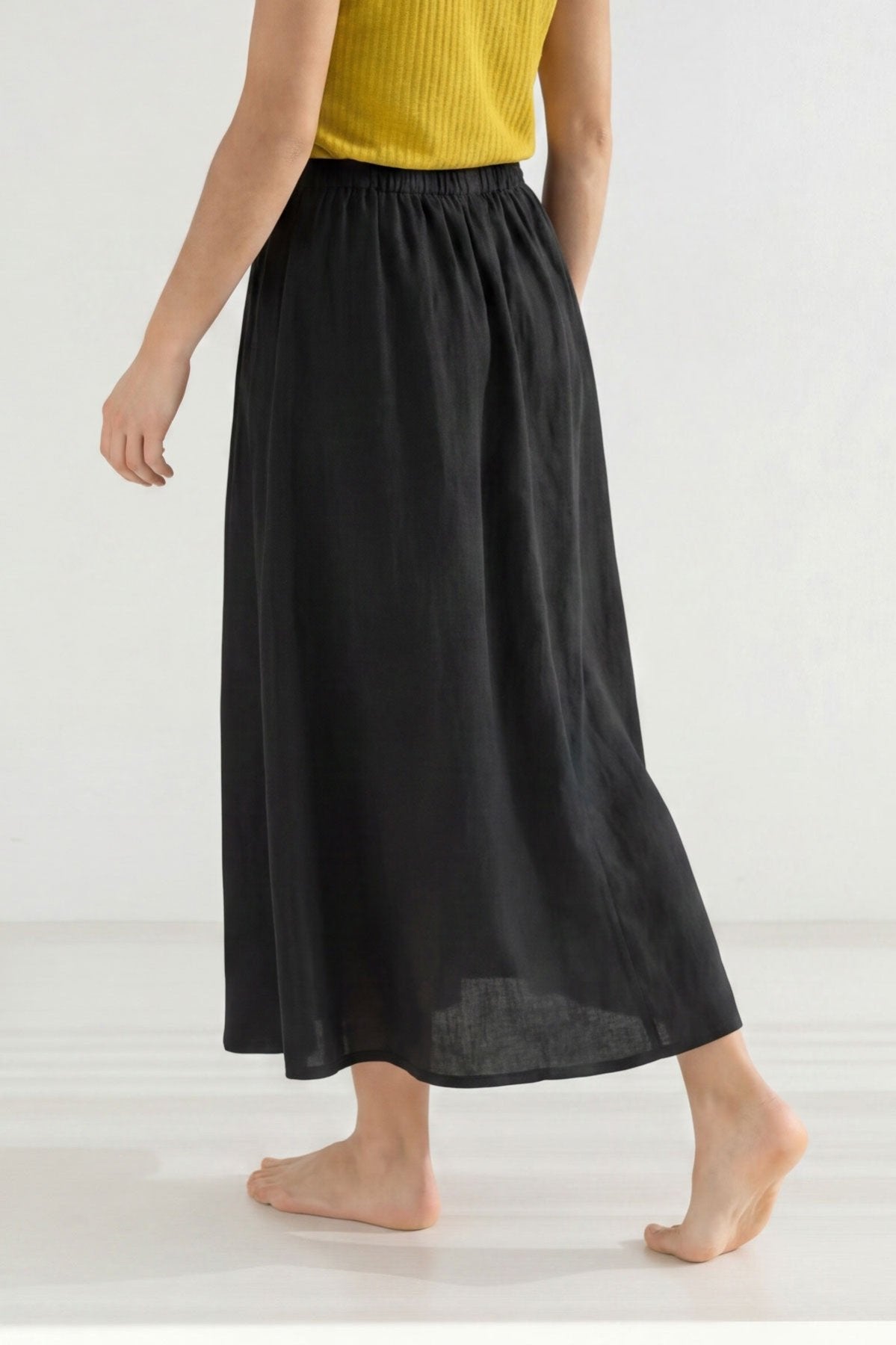 Black linen skirt women yellow top wear view back