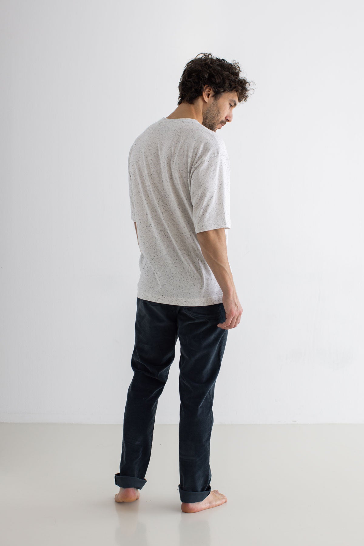 White Oversized t-shirt men navy pants full body view back