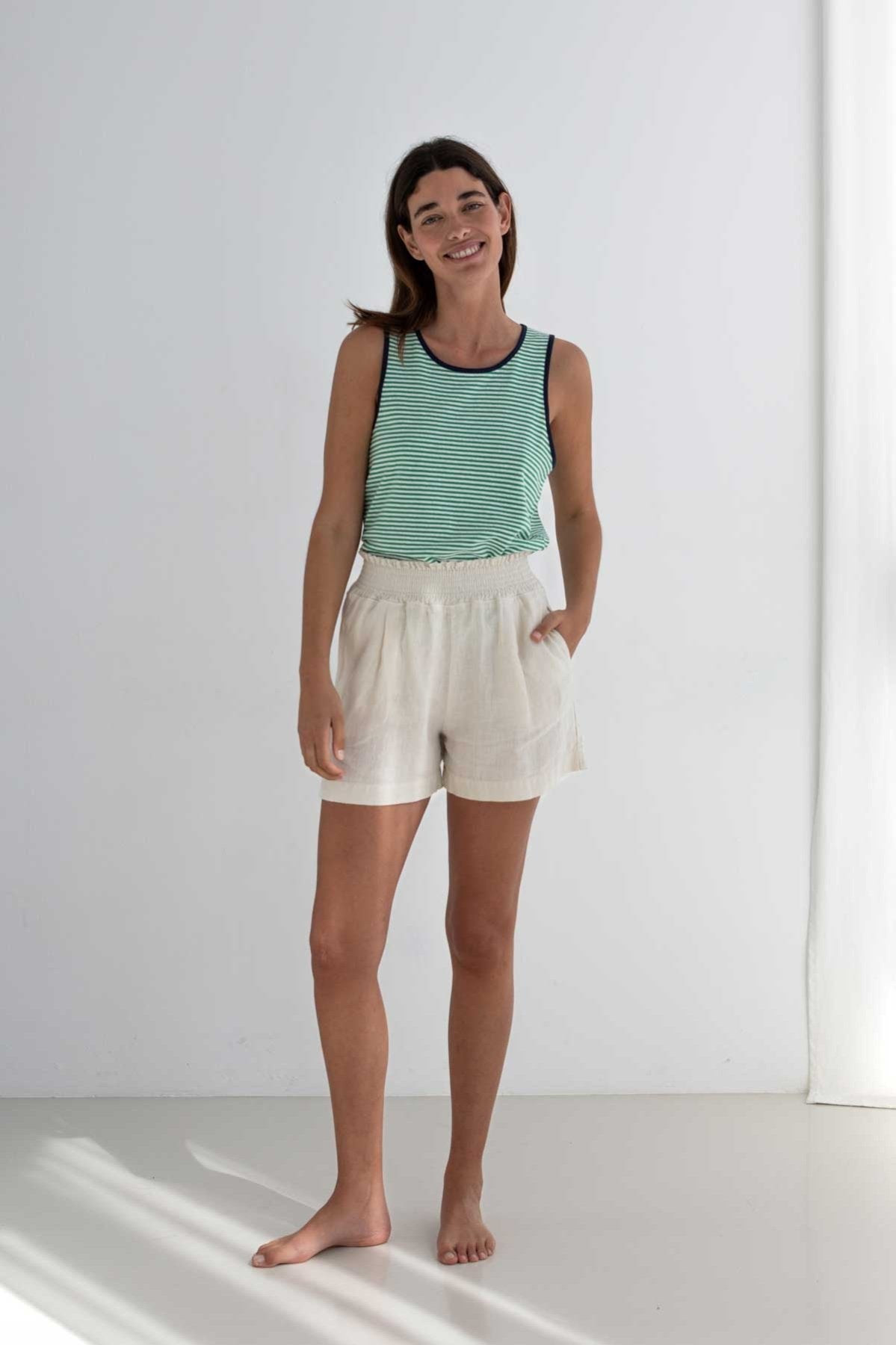 Green stripes lightweight vest top women white shorts full body view front