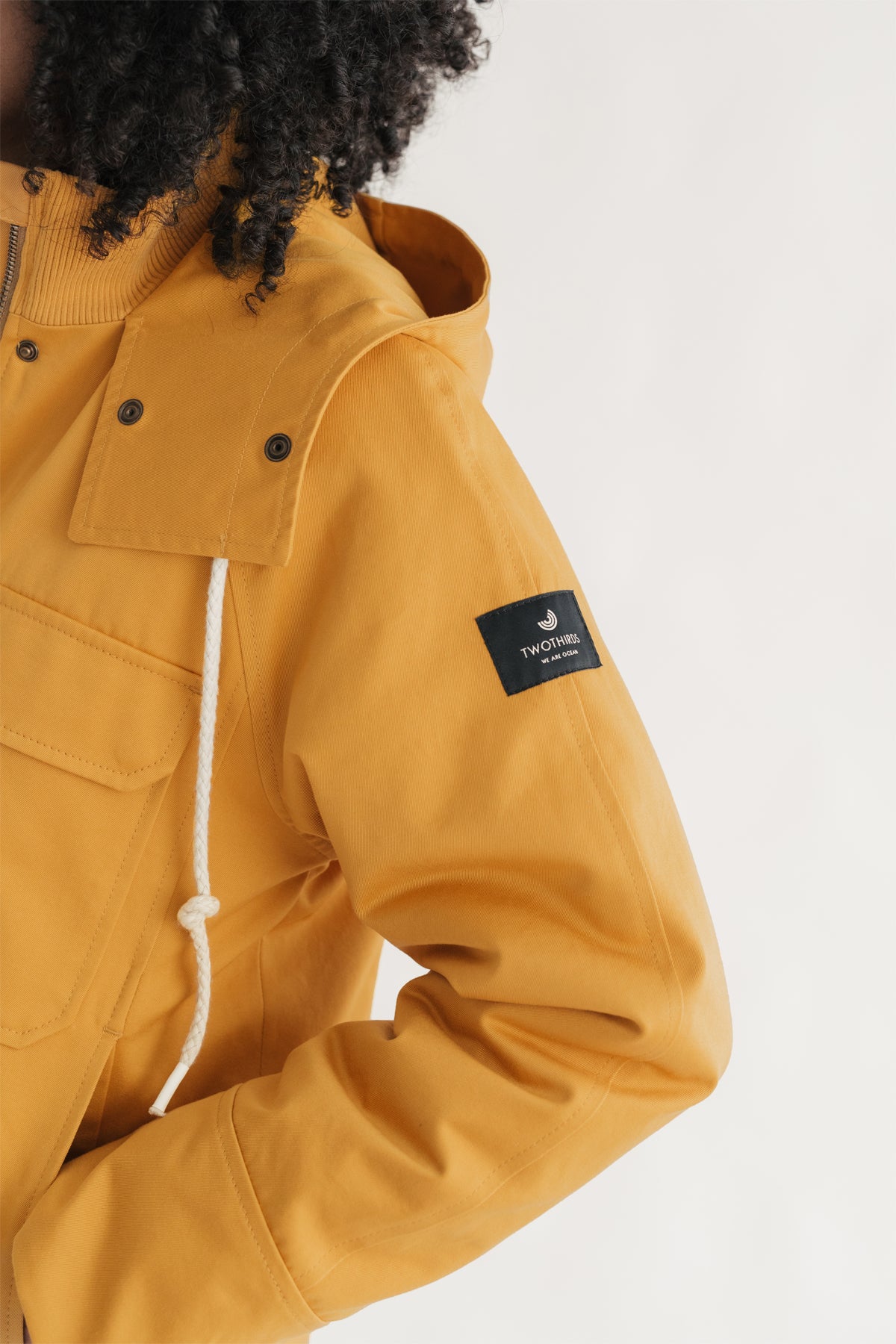 Yellow eco-friendly cropped parka for women.