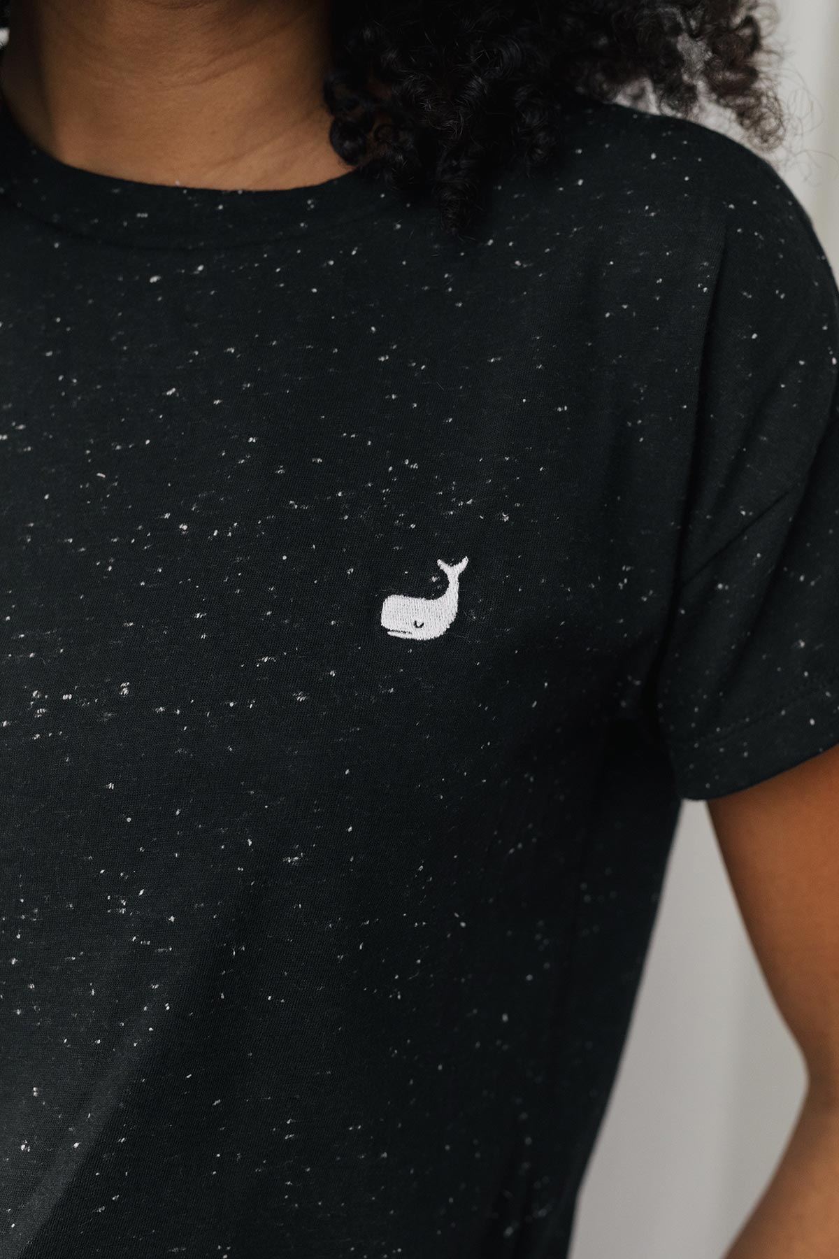 embroidered whale on black organic cotton tee