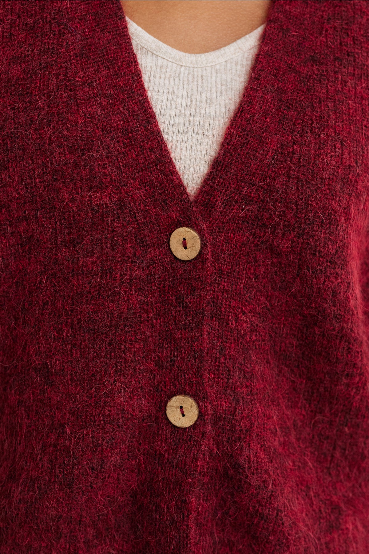 Women Burgundy knitwear with buttons.