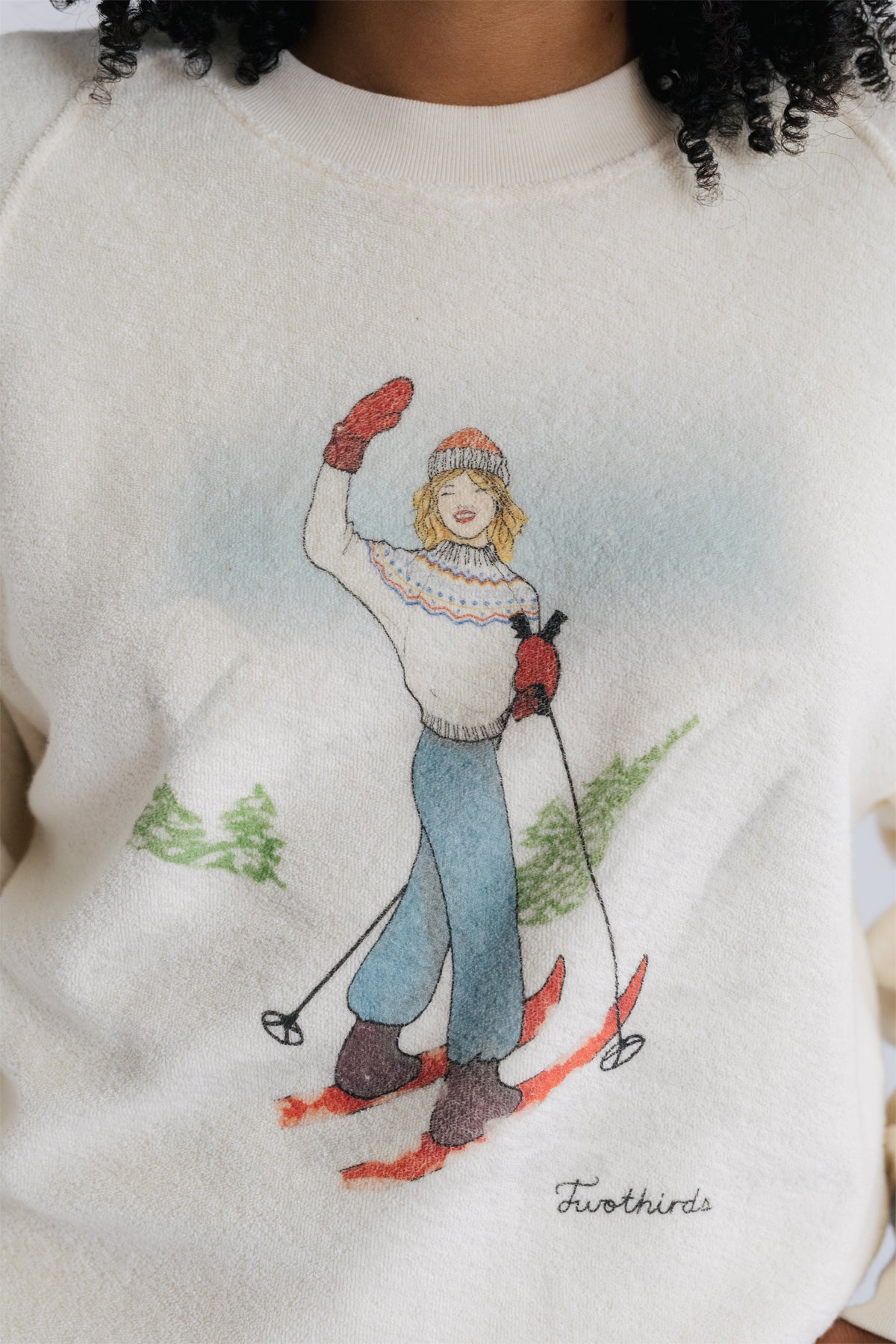 Women's sweatshirt with festive skier graphic.