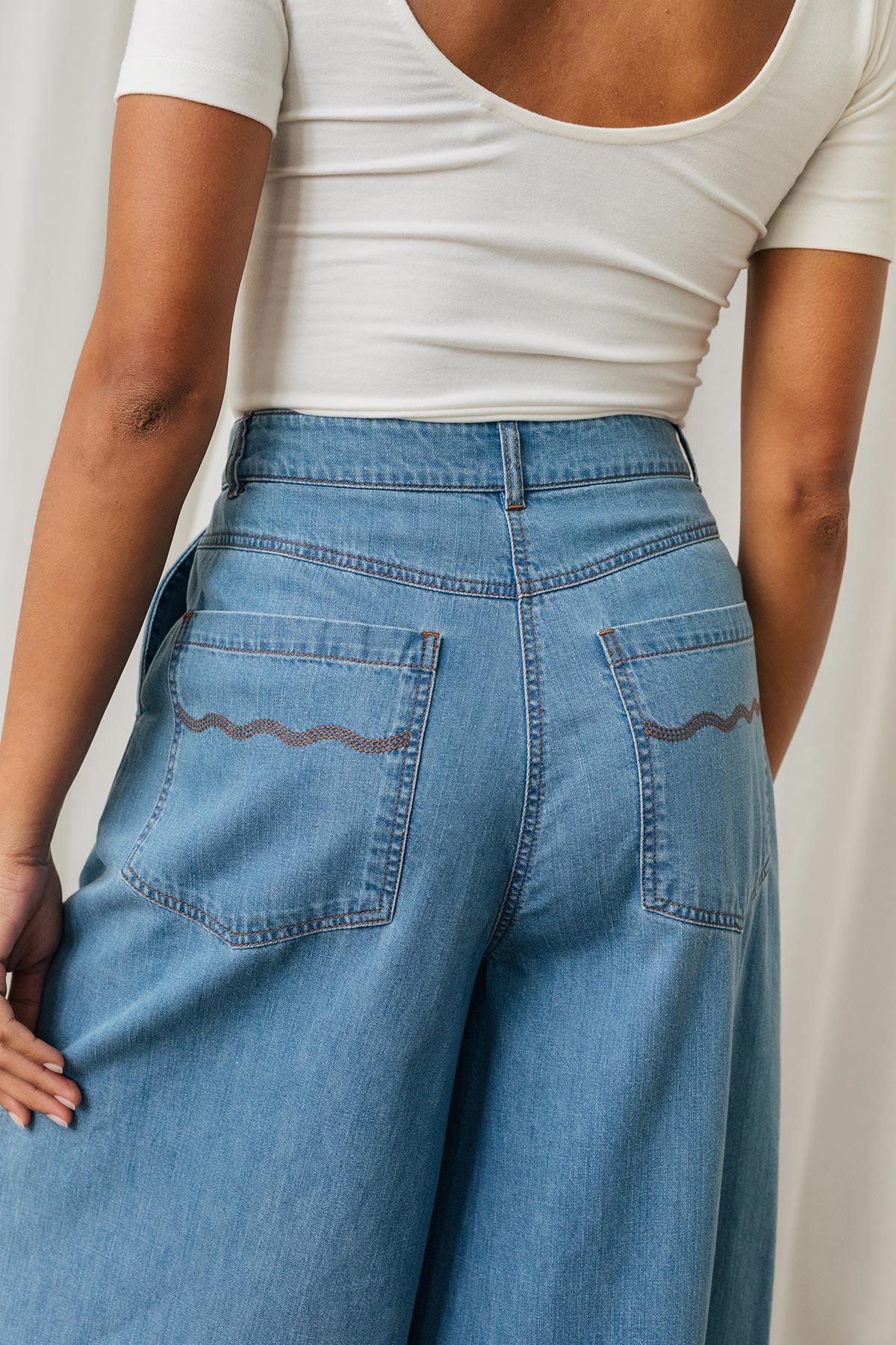 Eco-friendly jeans with wave embroidery