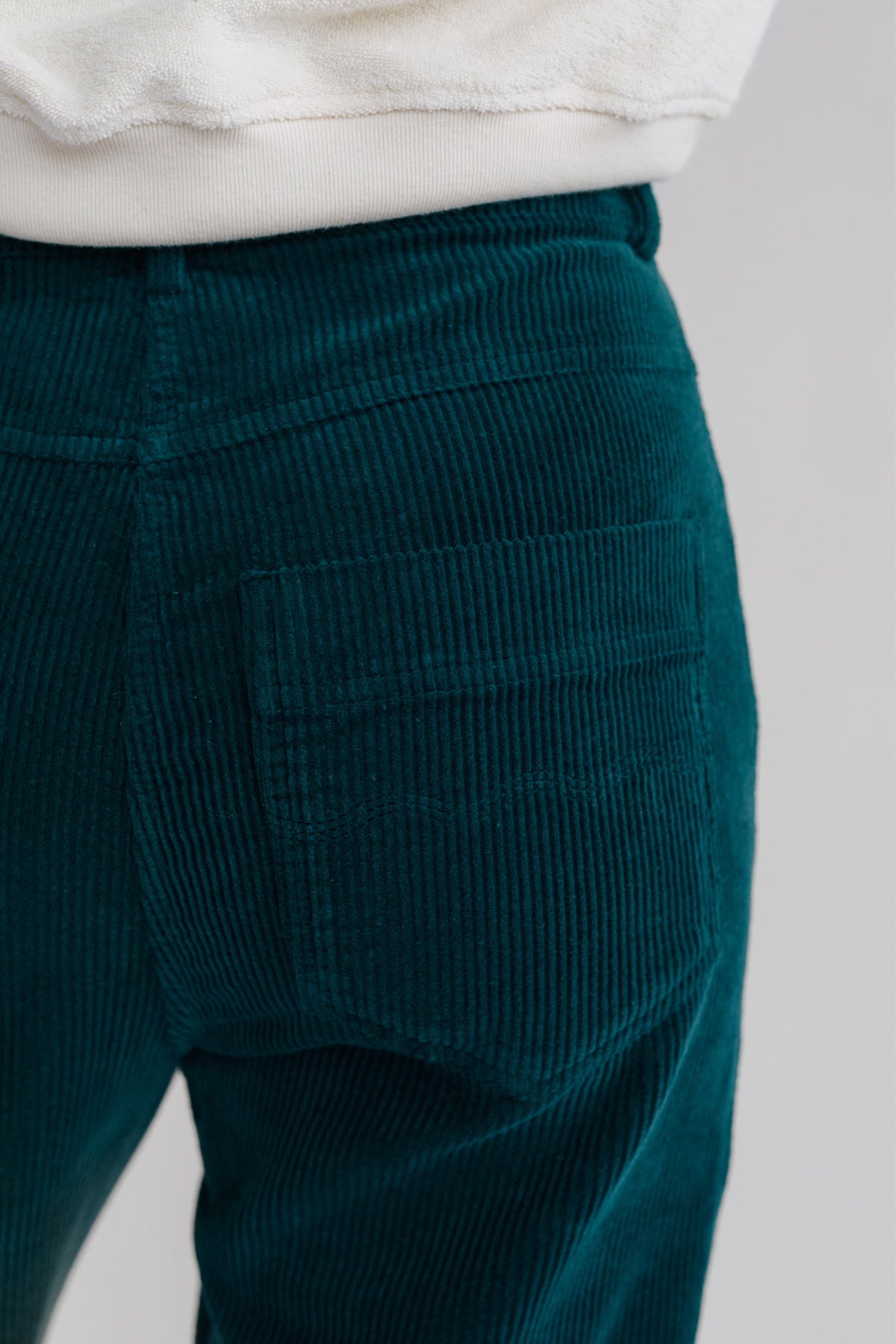 corduroy pants with embroidered back pockets.