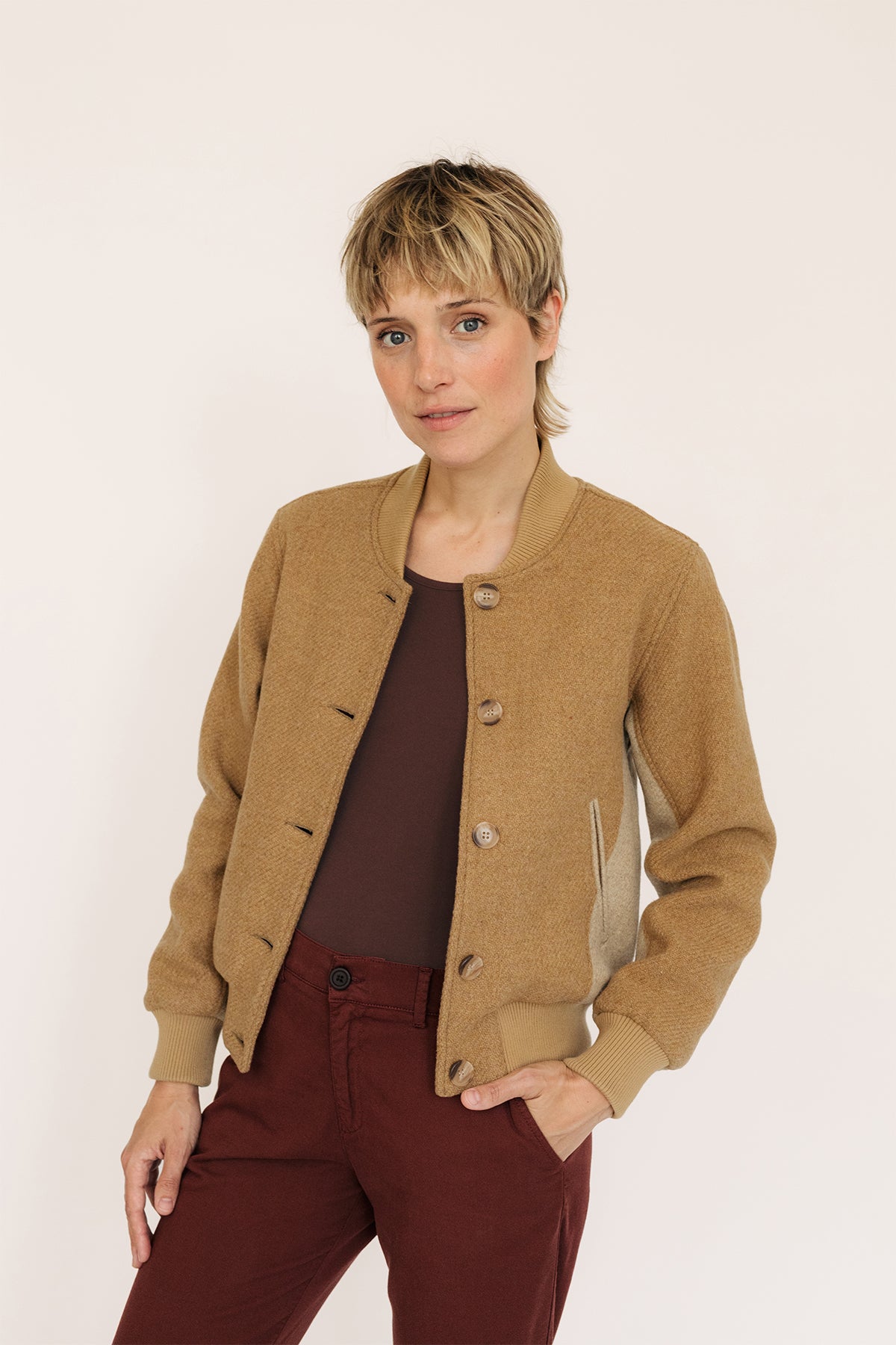 Recycled buttons on wool jacket for women.