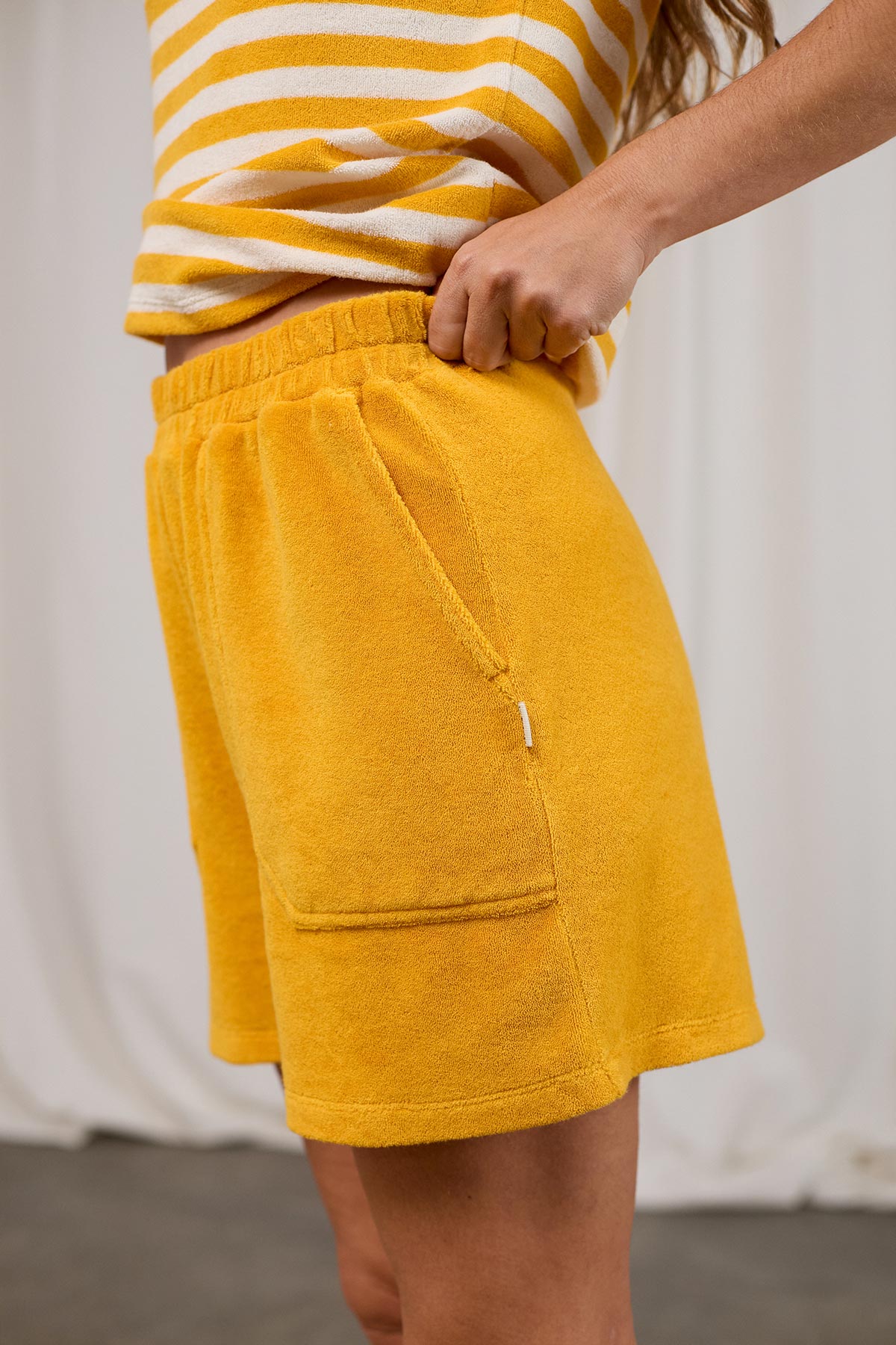 yellow terry towelling shorts with flexible waistband.