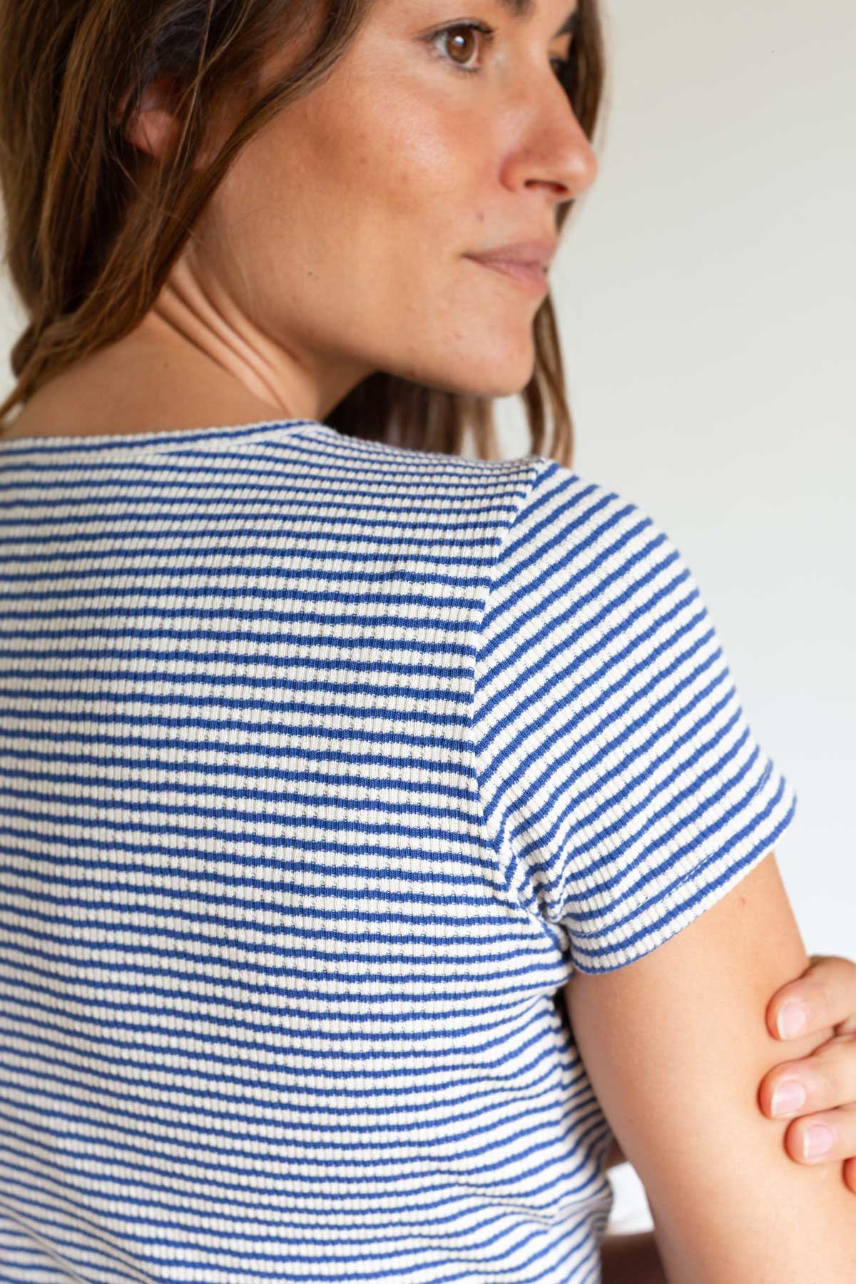 Back view detail showing the rib texture of a blue striped top.