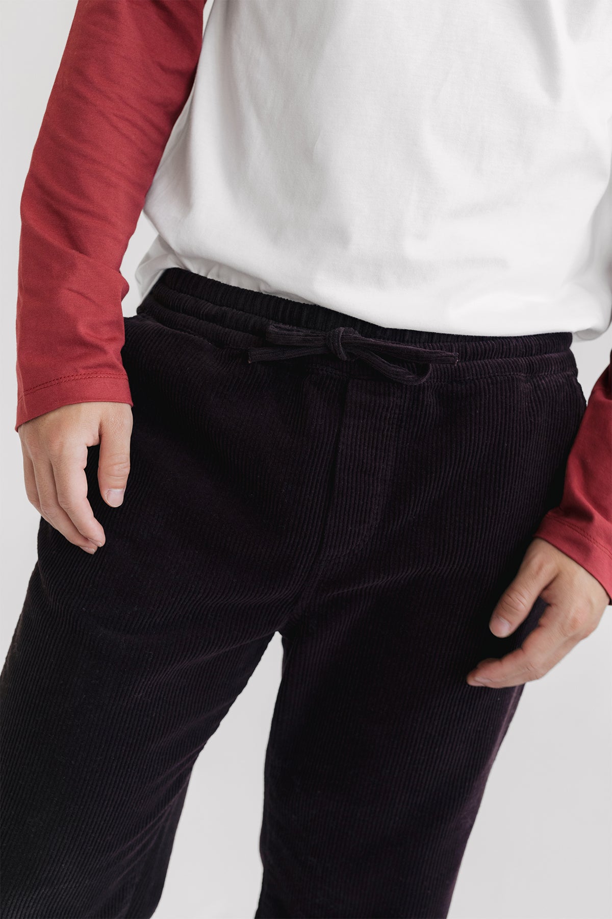 Elastic waistband with fabric drawstring pants.