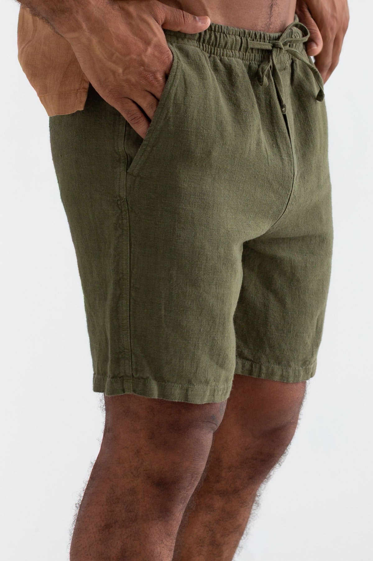 Codium green heavy linen shorts men adobe linen shirt wear view front 