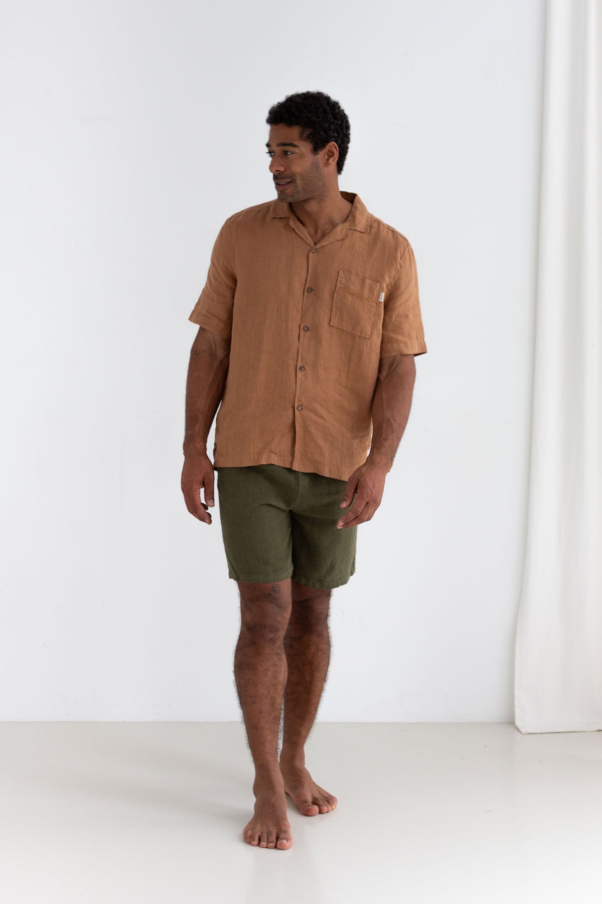 Codium green heavy linen shorts men adobe linen shirt full body view front