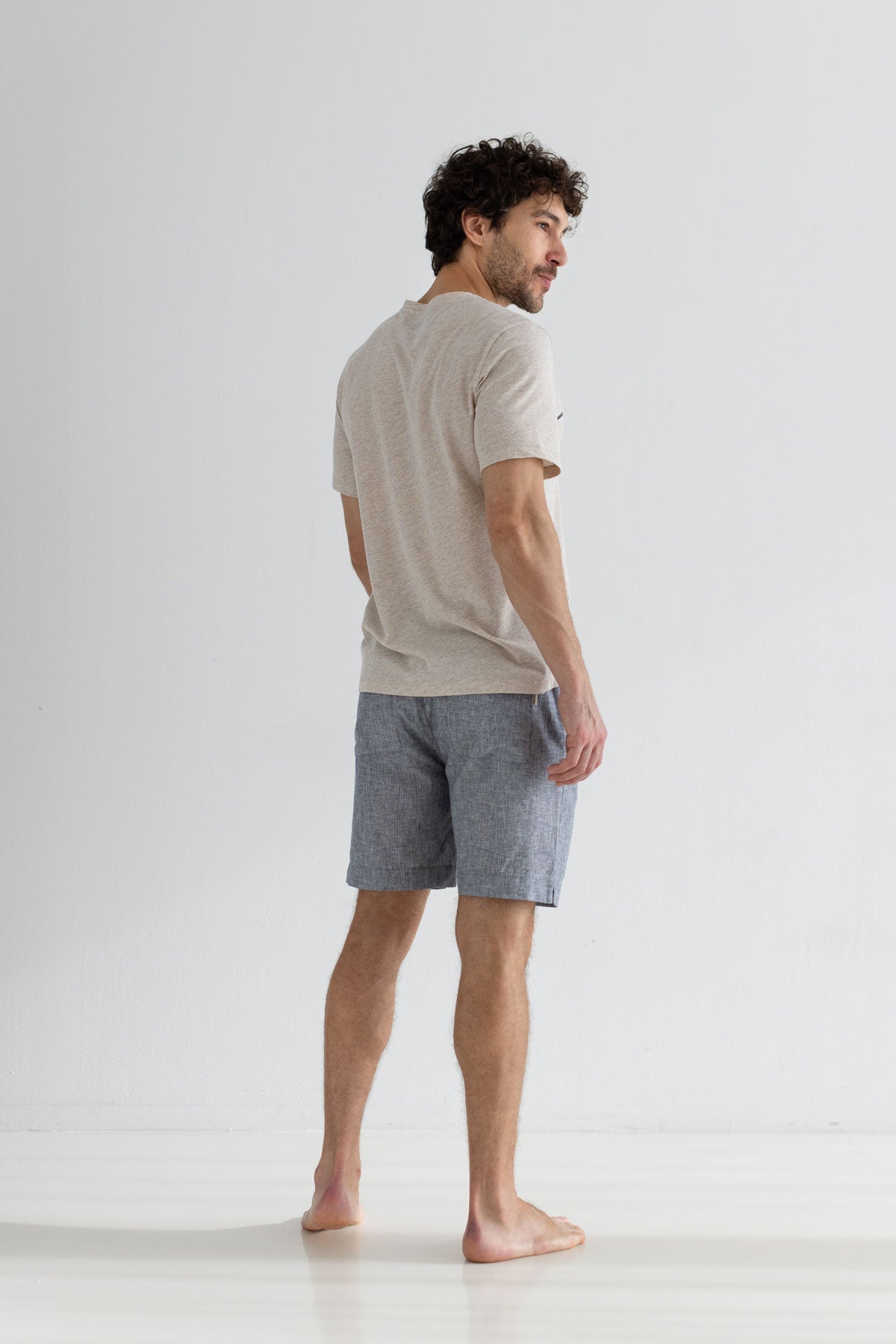 Lino graphic tshirt men striped shorts full body view back