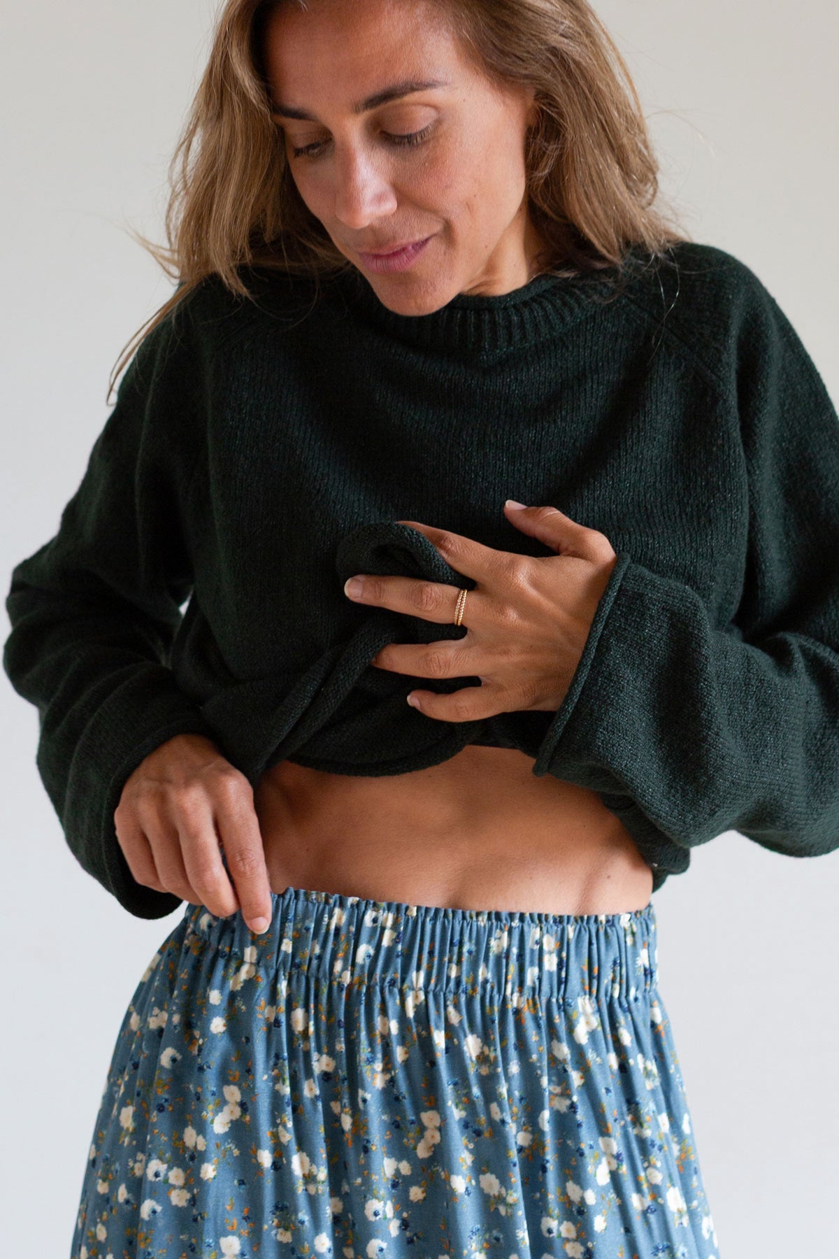 Close-up showing the elastic waistband of a blue floral organic cotton maxi skirt.
