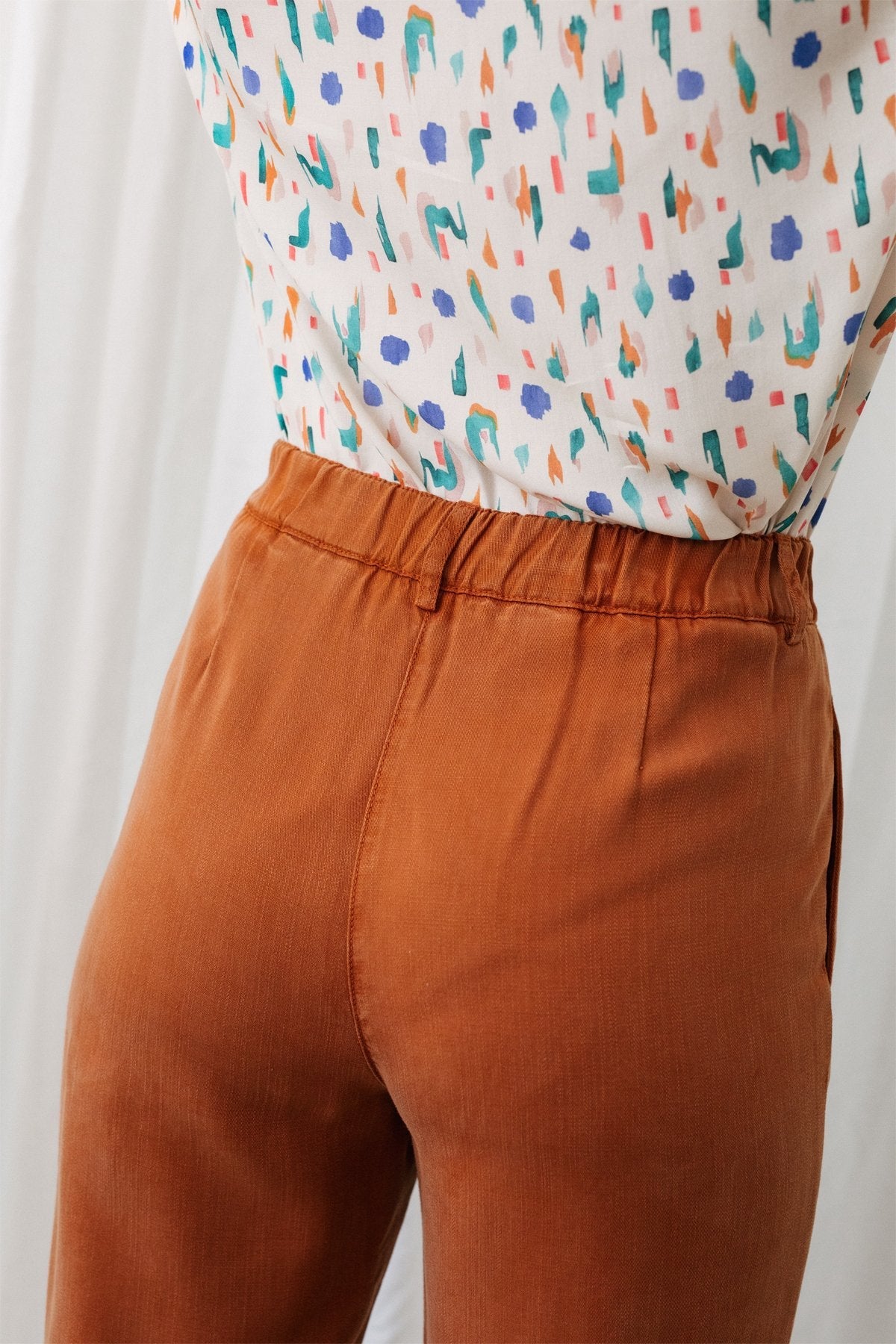 elasticated waist sustainable orange trousers