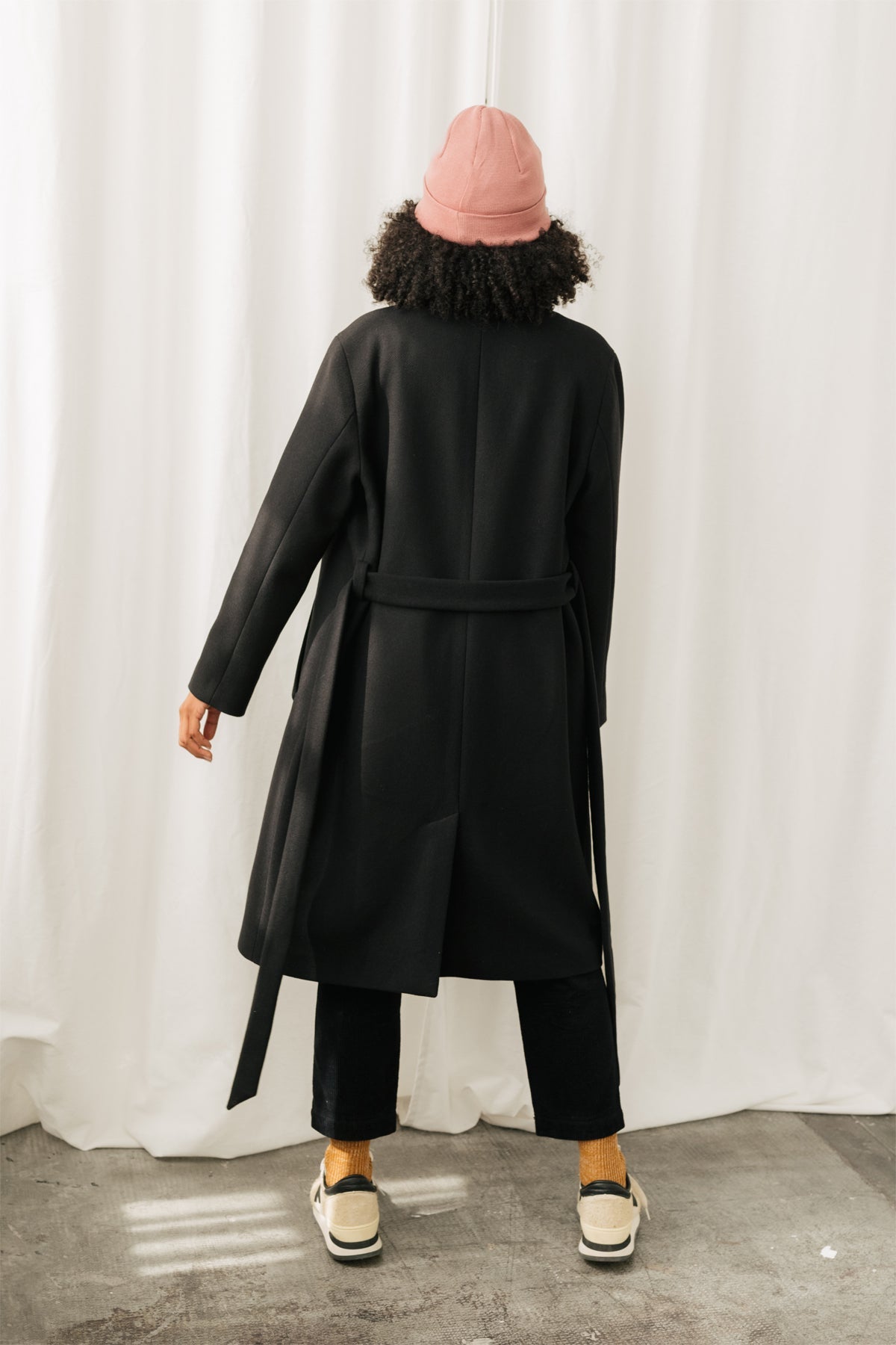 Full-length women's coat with regular fit.