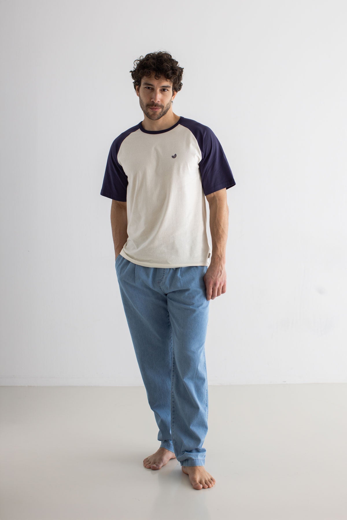 Light blue denim trousers men white blue tshirt full body view front