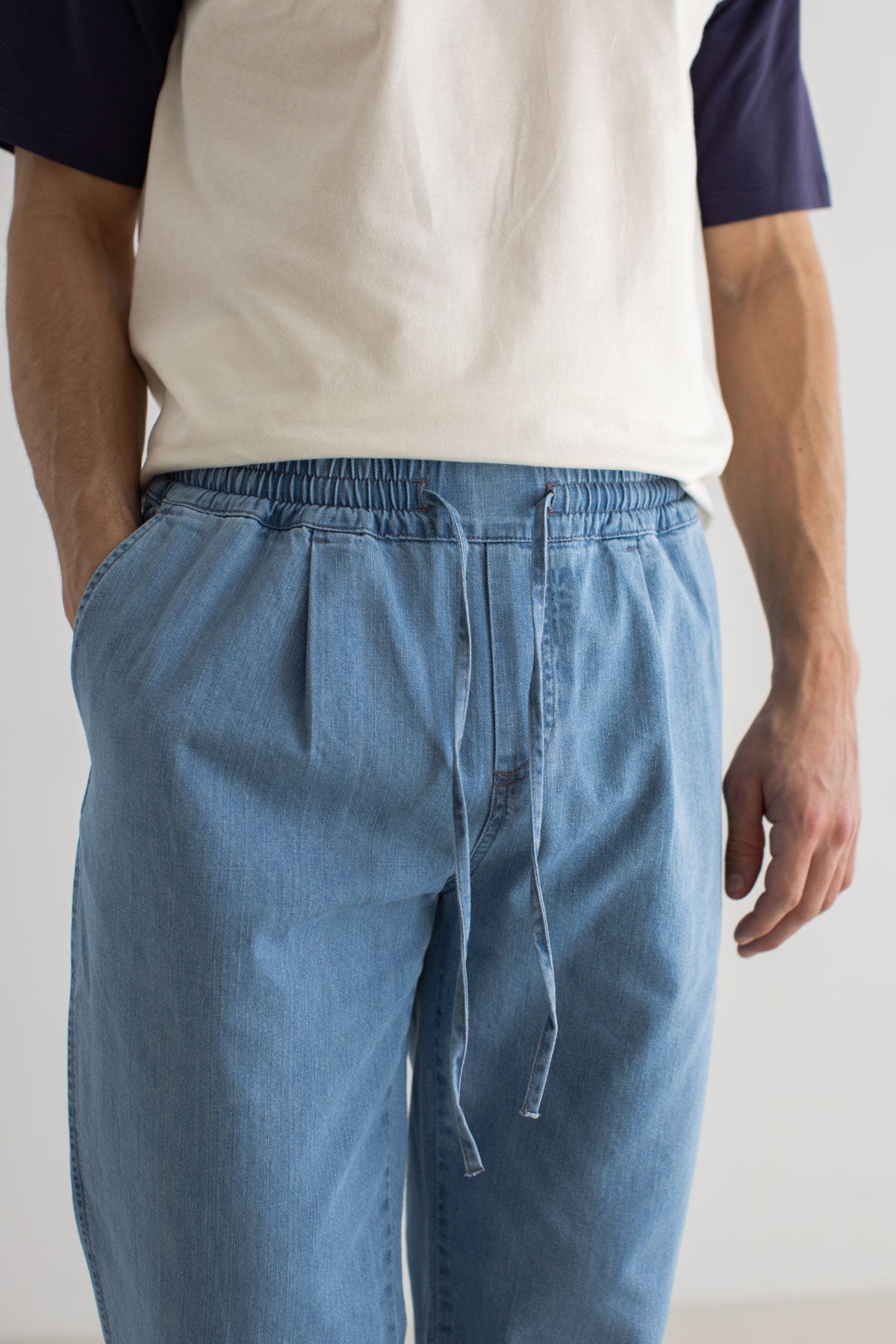 Light blue denim trousers men white blue tshirt wear view front