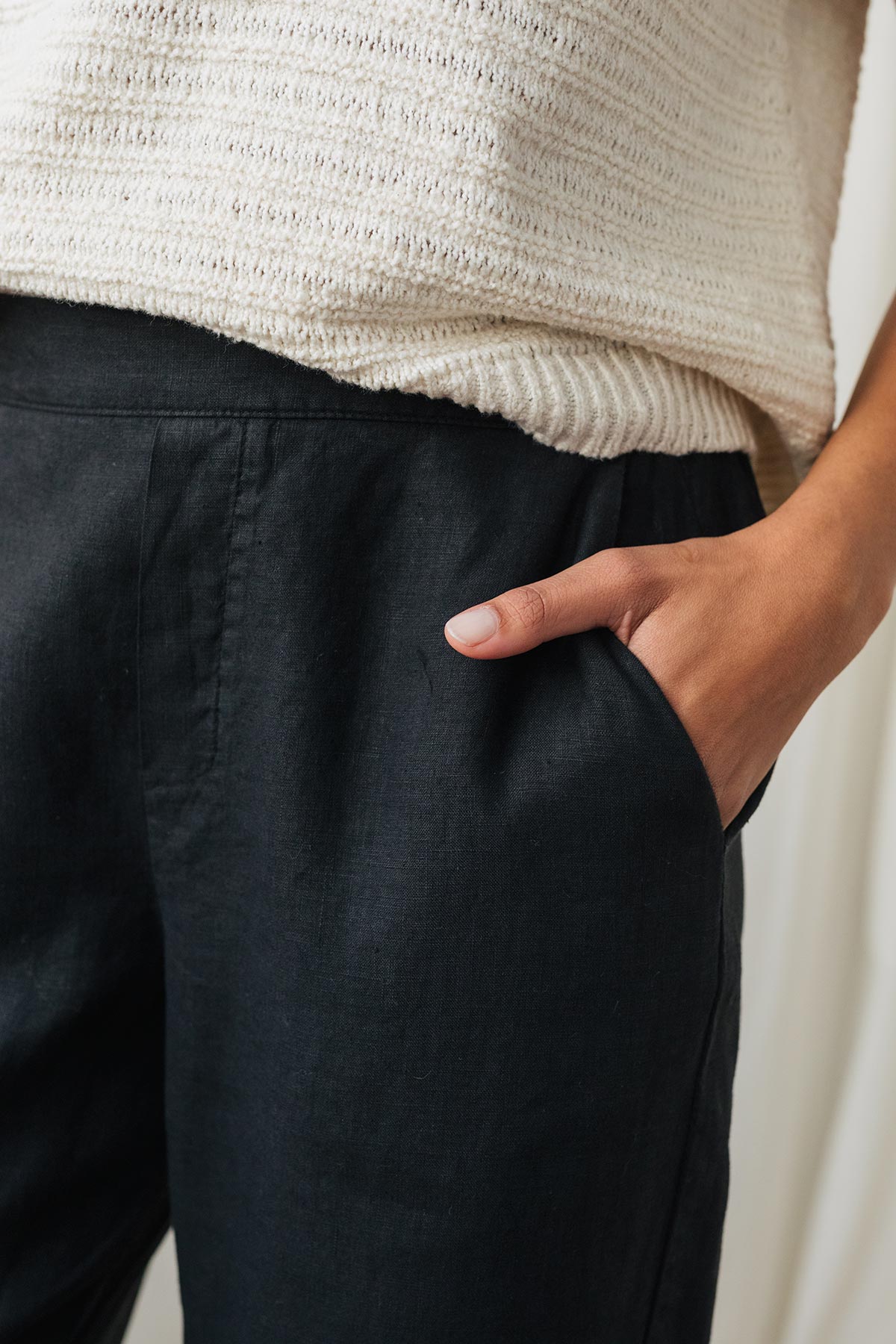 black linen pants with a straight leg cut and side pockets