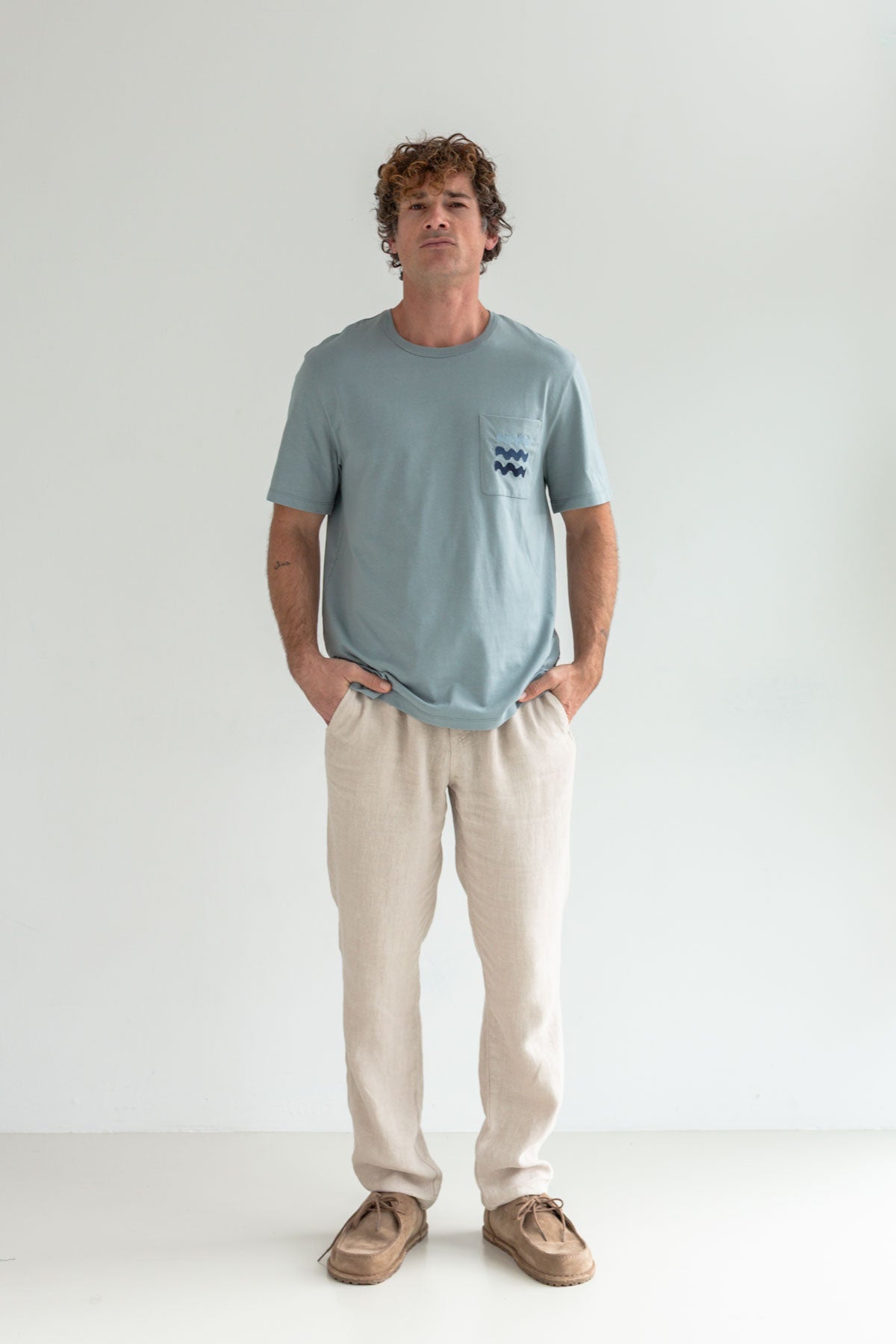 Lead sea roundneck shirt men light pants full body view front 